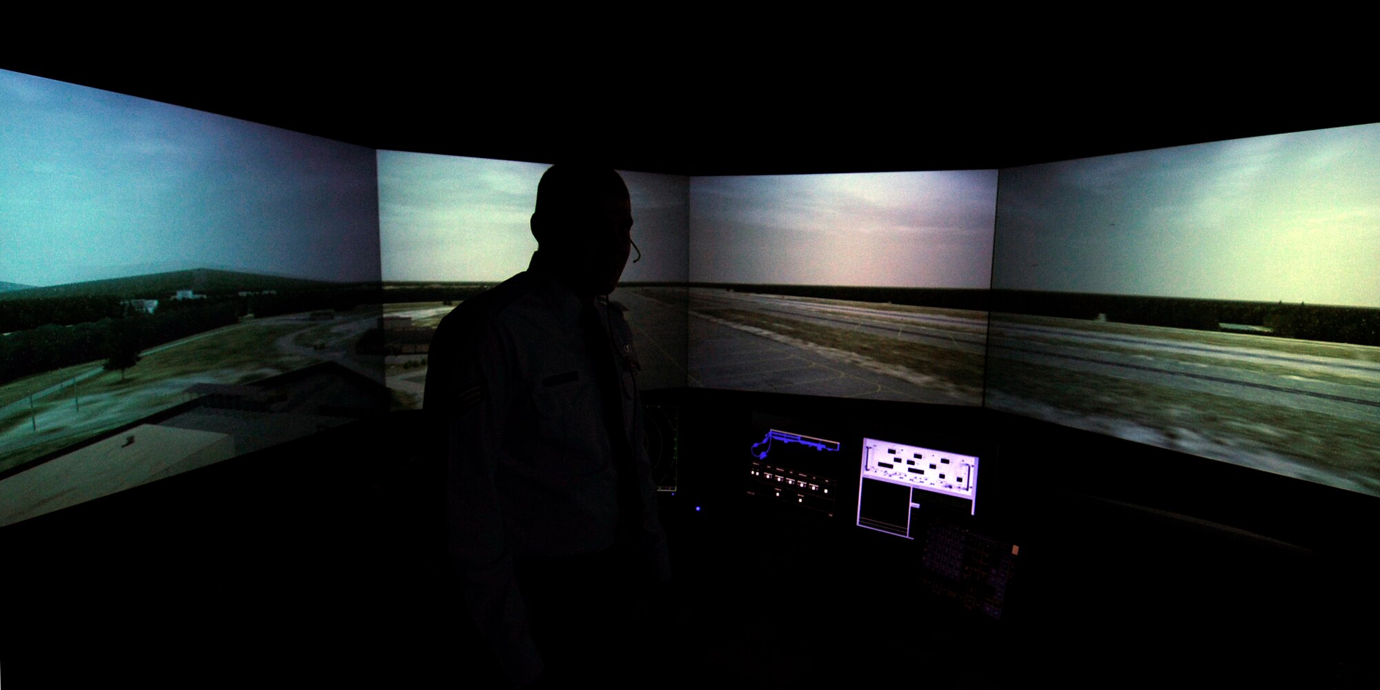 Senior Airman Jonathan Anderson executes a training module in an air traffic control simulator room Oct. 20, 2008 at Eielson Air Force Base, Alaska. The simulator can be programmed to run scenarios air traffic controllers would see during a Red Flag-Alaska exercise, keeping them proficient during the off season and ready for the next exercise. Airman Anderson is assigned to the 354th Operations Support Squadron.  (U.S. Air Force photo/Senior Airman Jonathan Snyder)