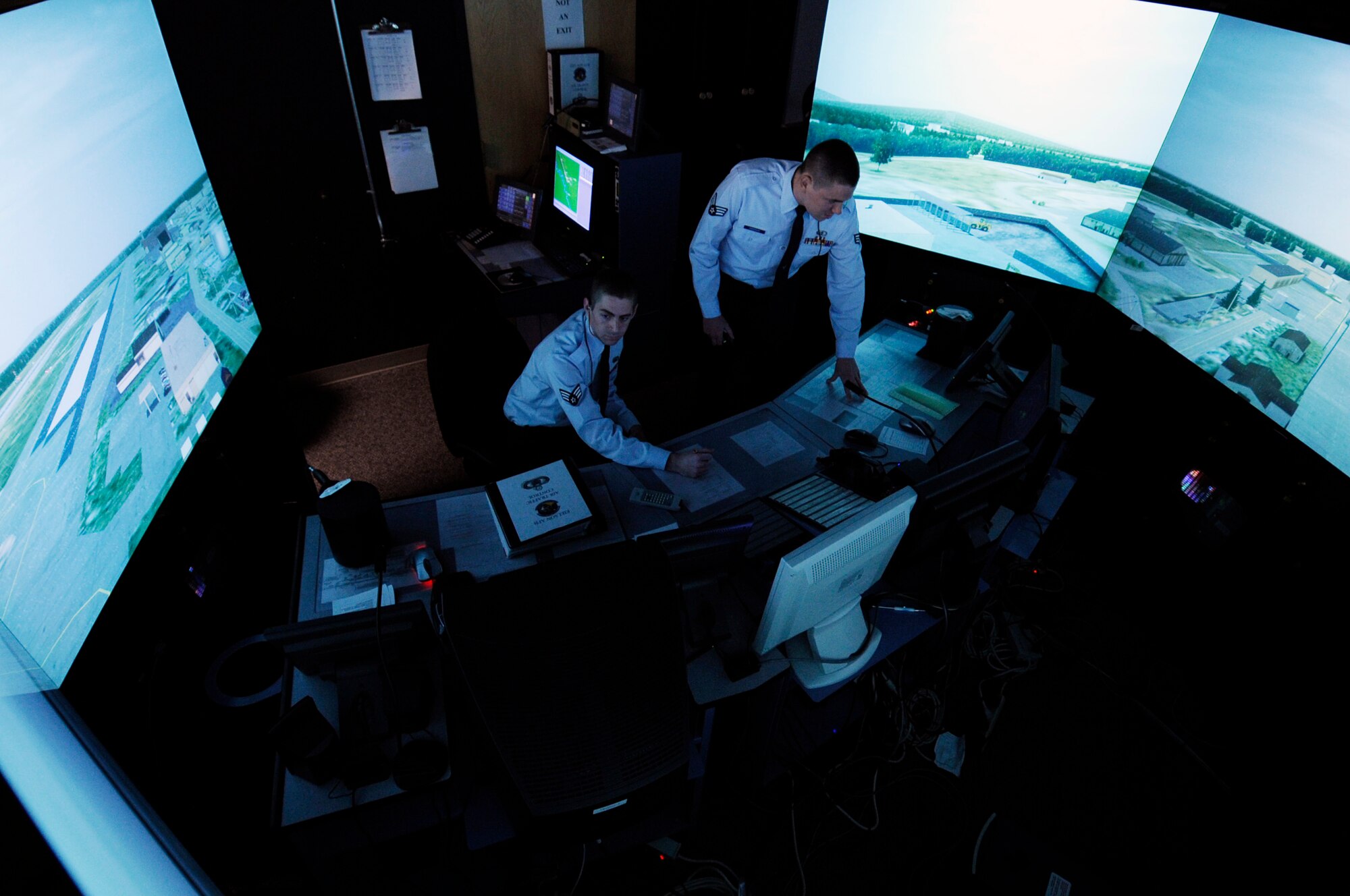 Senior Airman Jonathan Anderson and Senior Airman Christopher Wilson execute a training module in an air traffic control simulator room Oct. 20, 2008 at Eielson Air Force Base, Alaska. The simulator helps train and qualify air traffic control Airmen until they are 100 percent proficient at that scenario. Both Airmen are assigned to the 354th Operations Support Squadron.  (U.S. Air Force photo/Senior Airman Jonathan Snyder)