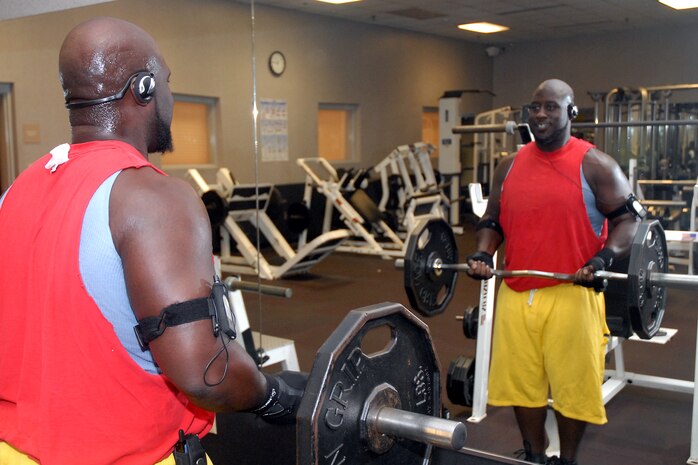 Dominick Ward does bicep curls at the Charleston AFB fitness and sports center Oct. 15. He recently lost 120 pounds with the help of wingmen and an Air Force Instruction allowing him excused absence to exercise three hours a week during the work day. Mr. Ward is a civilian pickup and delivery forklift operator assigned to the 437th Logistics Readiness Squadron. (U.S. Air Force photo/Airman 1st Class Melissa White)