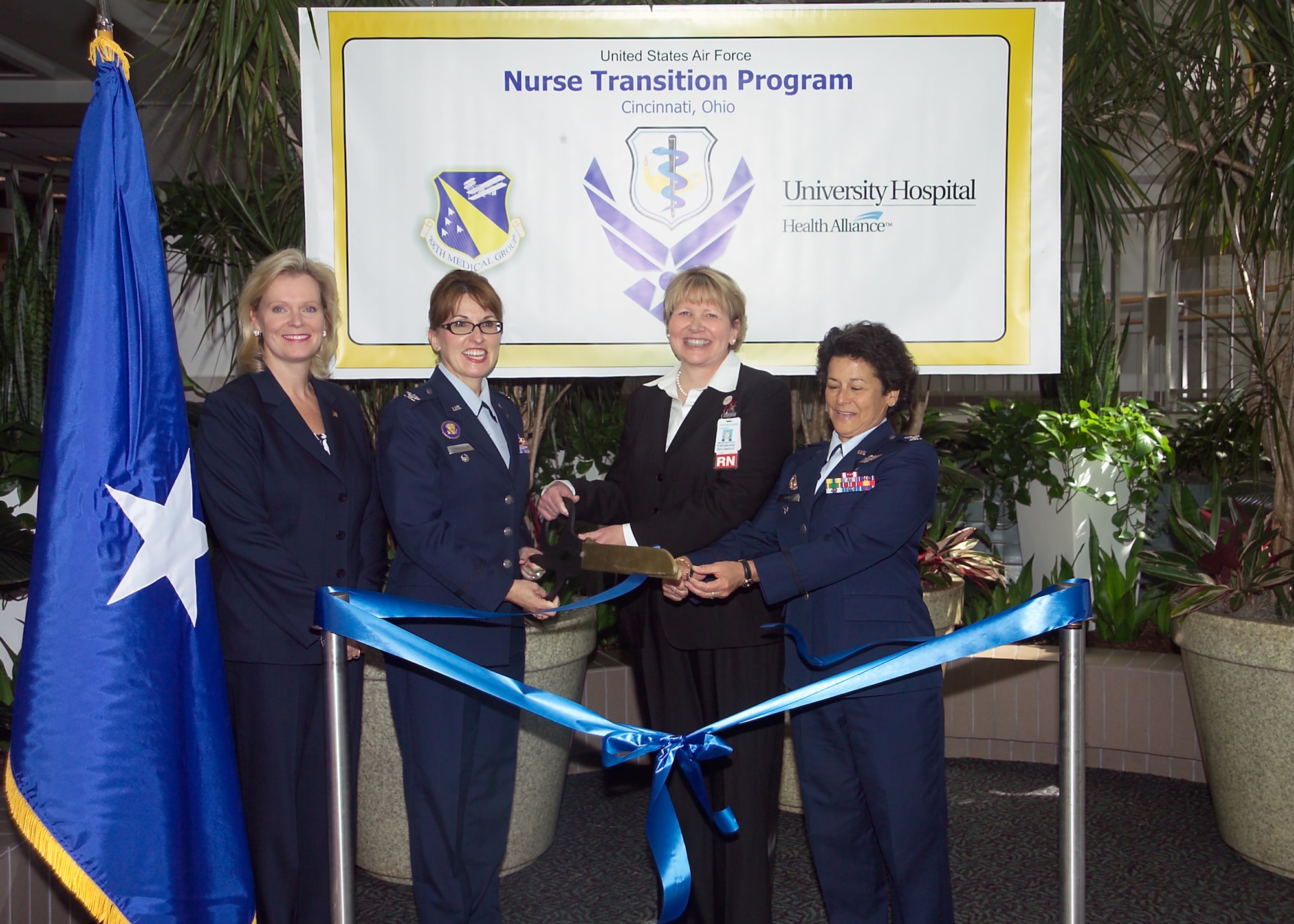 University Hospital Cincinnati and the U.S. Air Force inaugurated the Nurse Transition Program Oct. 7 to provide newly graduated registered nurses advanced clinical and deployment readiness training for service in the Air Force Nurse Corps. Cutting the ribbon are (L-R) : Lee Ann Liska, Executive Director & Senior Vice President, UH-Cincinnati; Col. Kimberly Siniscalchi, Assistant Air Force Surgeon General, Medical Force Development, and Assistant Air Force Surgeon General, Nursing Services;  Mavis Bechhtle, Chief Nursing Officer; and Col. Linda Kisner, Chief of Education and Training Division and Director of Air Force Nursing Services. (U.S. Air Force photo)