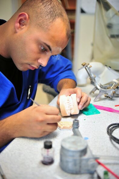 Staff Sgt. Nabeel Razzak, 355th Dental Squadron dental laboratory technician, creates a patient's diagnostic mock-up here, October 17. A diagnostic mock-up is used to help a doctor visualize the end-product of a patient's tooth. (U.S. Air Force photo/Senior Airman Noah R. Johnson) 