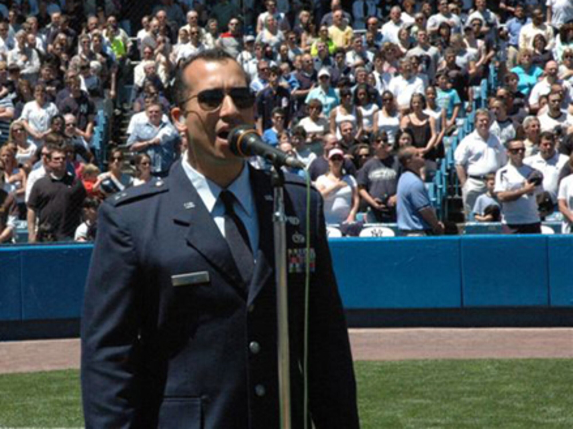 Capt. Edward Torres, an Air Force reservist from Duke Field, Fla., is slated to sing “God Bless America” during the 7th inning stretch of Game 2 of the 2008 World Series in Tampa, Fla., Oct. 23. Fox TV will air the game, starting at 8 p.m. Eastern Time. The 919th Logistics Readiness Squadron officer is no stranger to performing at Major League Baseball games. In this photo he sings the National Anthem before a special New York Yankees versus Seattle Mariners game that recognized the heritage of the Tuskegee Airmen May 25 at the Yankee Stadium in New York. (Courtesy photo)



