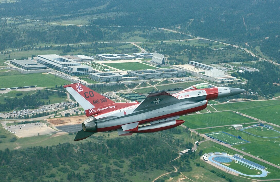 An F-16 aircraft painted in the color scheme of the original Air National Guard flight demonstration team takes flight from the 140th Wing, Buckley Air Force Base, July 26, 2006. This F-16 is flying in front of the Air Force Academy near Colorado Springs, Colorado.  The 140th Wing of the Colorado Air National Guard has reached the 50th anniversary as the only flying acrobatic Air National Guard team, and to commemorate this event they have painted an F-16 aircraft in the same paint scheme as the original F-86s were 50 years ago. (U.S. Air Force photo by Senior Master Sgt. John Rohrer) (Released), Official Photo by: SMSGT JOHN ROHRER, 140TH WING , BUCKLEY AFB, COLO. , United States