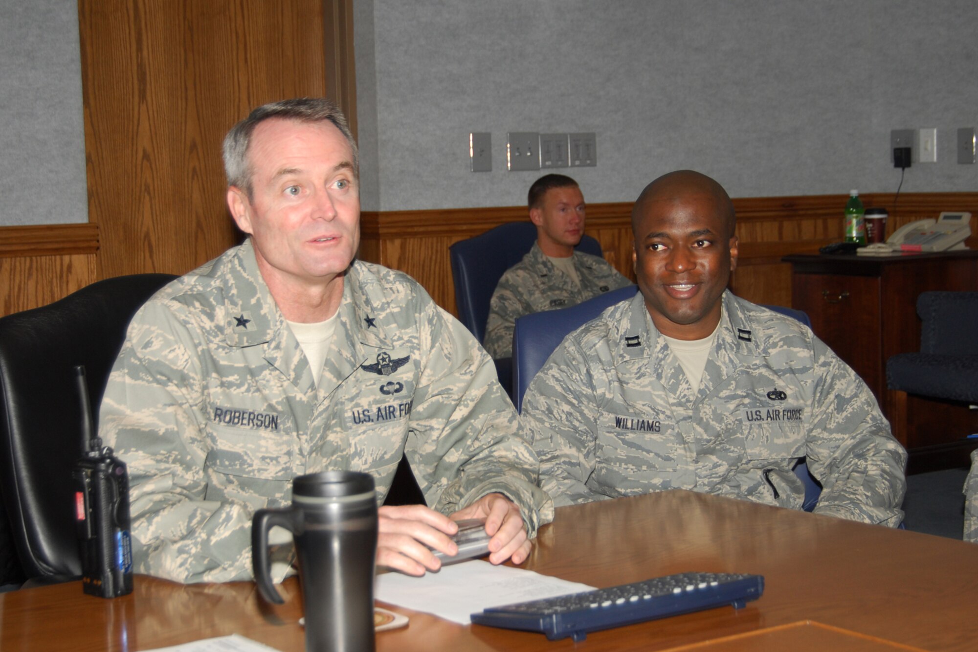 Capt. Craig Williams, 325th Maintenance Squadron munitions flight commander, shadows Brig. Gen. Darryl Roberson, 325th Fighter Wing commander, during the commander’s staff meeting here today.  Captain Williams leads 166 Airmen and 10 elements in providing 82 F-15C and F-22 aircrafts worth more than five billion dollars.  He is also a weapons instructor and directs support for dissimilar aircraft combat training. Captain Williams spent the day with General Roberson as part of the Commander’s Shadow Program.  He has served almost 20 years in the military and is a native of Thomasville Ga.  (U.S. Air Force photo by Susan Trahan)