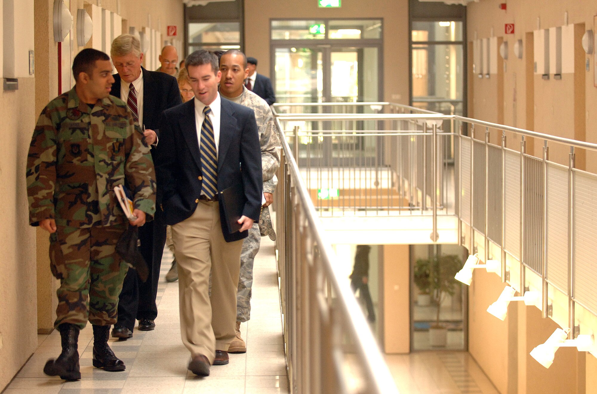 Keith Baker and Adam Johnson receive a tour of the 435th Civil Engineer Squadron dorm Oct. 16 at Ramstein Air Base, Germany. The visit was part of a Department of Defense-wide investigation to assess the quality of unaccompanied housing offered to single servicemembers. Mr. Baker and Mr. Johnson are House Appropriations Committee staff delegates. (U.S. Air Force photo/Master Sgt. Scott Wagers) 

