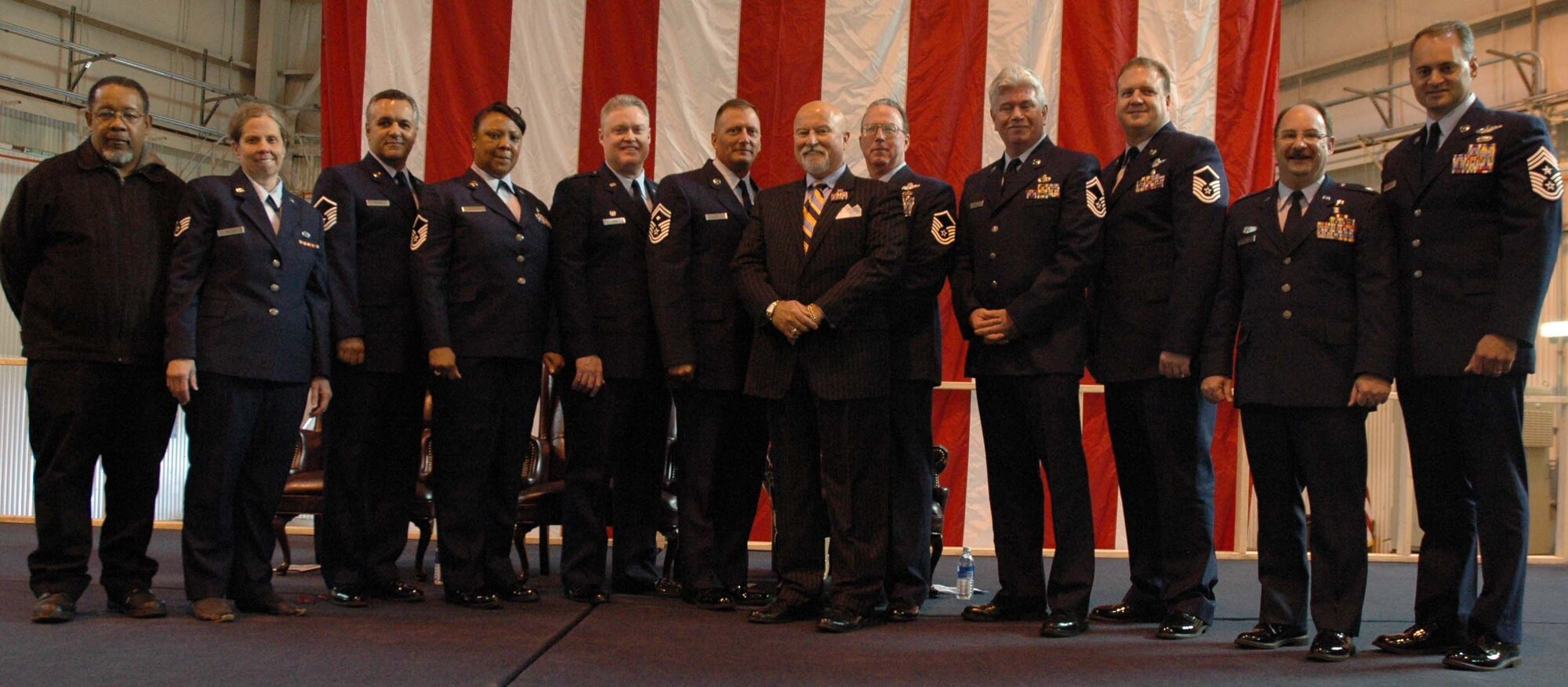 MCGUIRE AIR FORCE BASE, NJ -- Retired members of the 514th Air Mobility Wing join wing leaders and guest speaker Col. (Ret.) Seamus McCaffrey (center wearing suit) during a recent annual retirement ceremony held here. The Reserve members each received a retirement certificate from the Chief of Staff of the Air Force and a certificate of appreciation from President George W. Bush. (U.S. Air Force photo/Senior Airman William P. O'Neil III)