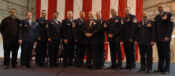 MCGUIRE AIR FORCE BASE, NJ -- Retired members of the 514th Air Mobility Wing join wing leaders and guest speaker Col. (Ret.) Seamus McCaffrey (center wearing suit) during a recent annual retirement ceremony held here. The Reserve members each received a retirement certificate from the Chief of Staff of the Air Force and a certificate of appreciation from President George W. Bush. (U.S. Air Force photo/Senior Airman William P. O'Neil III)