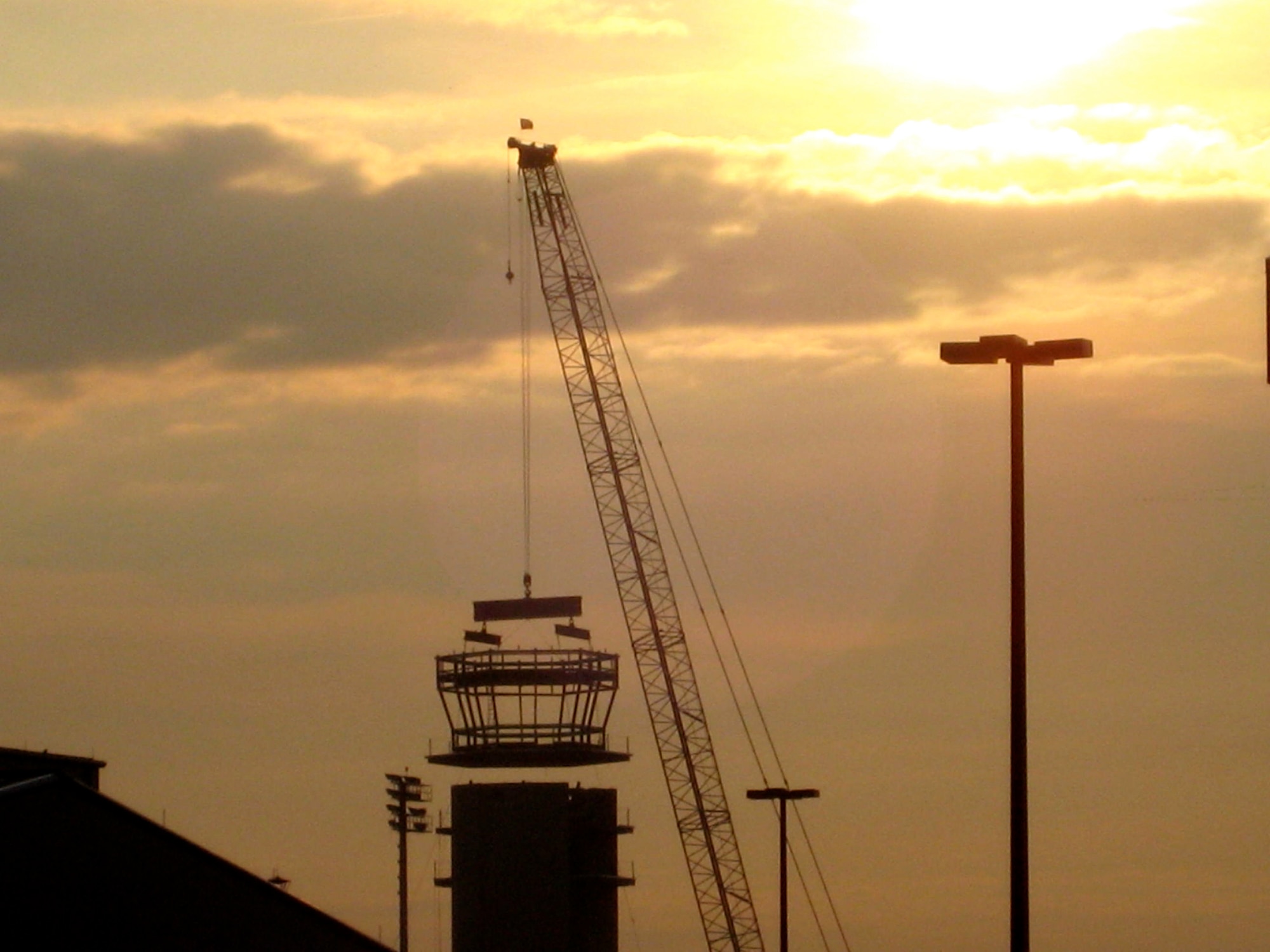 Contractors lower the cab into place for Dover?s new Air Traffic Control Tower Oc.t 15.  The new tower is scheduled to be completed in April 2009.  (U.S. Air Force photo/1st Lt. Lori Houck)