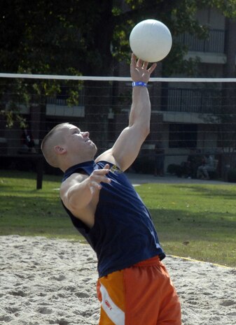 Airman Ryan Mathesius serves the ball to opposing Airmen playing volleyball during Oktoberfest on Charleston AFB Oct. 17. The Charleston AFB Top 3 provided food, drinks and entertainment for junior-enlisted Airmen during the annual event. Airman Mathesius is with the 437th Civil Engineer Squadron. (U.S. Air Force photo/Master Sgt. Paul Kilgallon)  