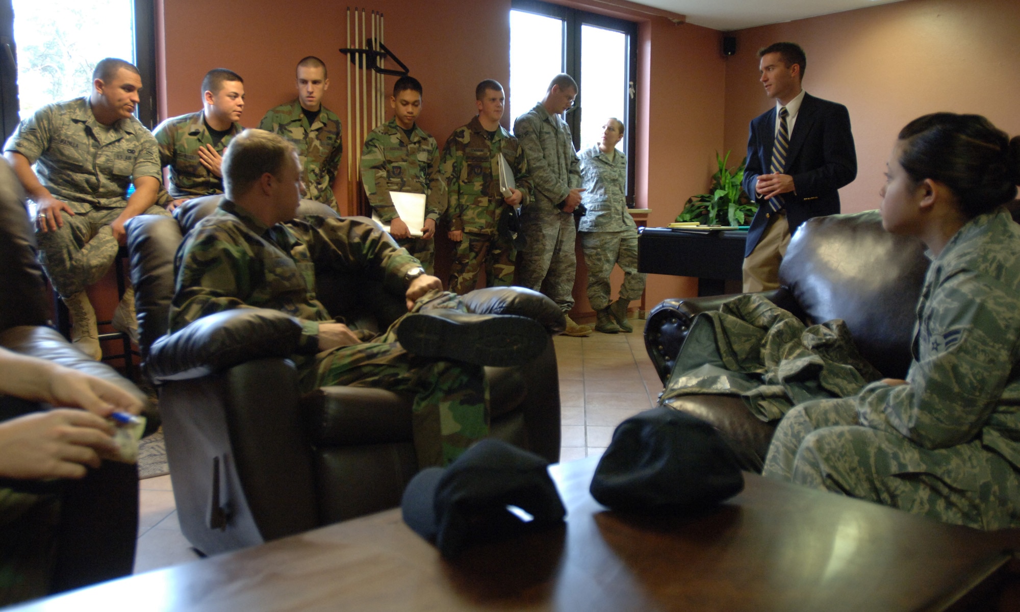 Adam Johnson (second from right),  a House Appropriations Committee staff delegate, meets with 25 Airmen representing the Kaiserslautern Military Community dorm council to assess the quality of unaccompanied housing offered to single service members. The visit was part of a DOD-wide investigation that canvassed nearly 60 installations. (DOD photo/ Master Sgt. Scott Wagers)