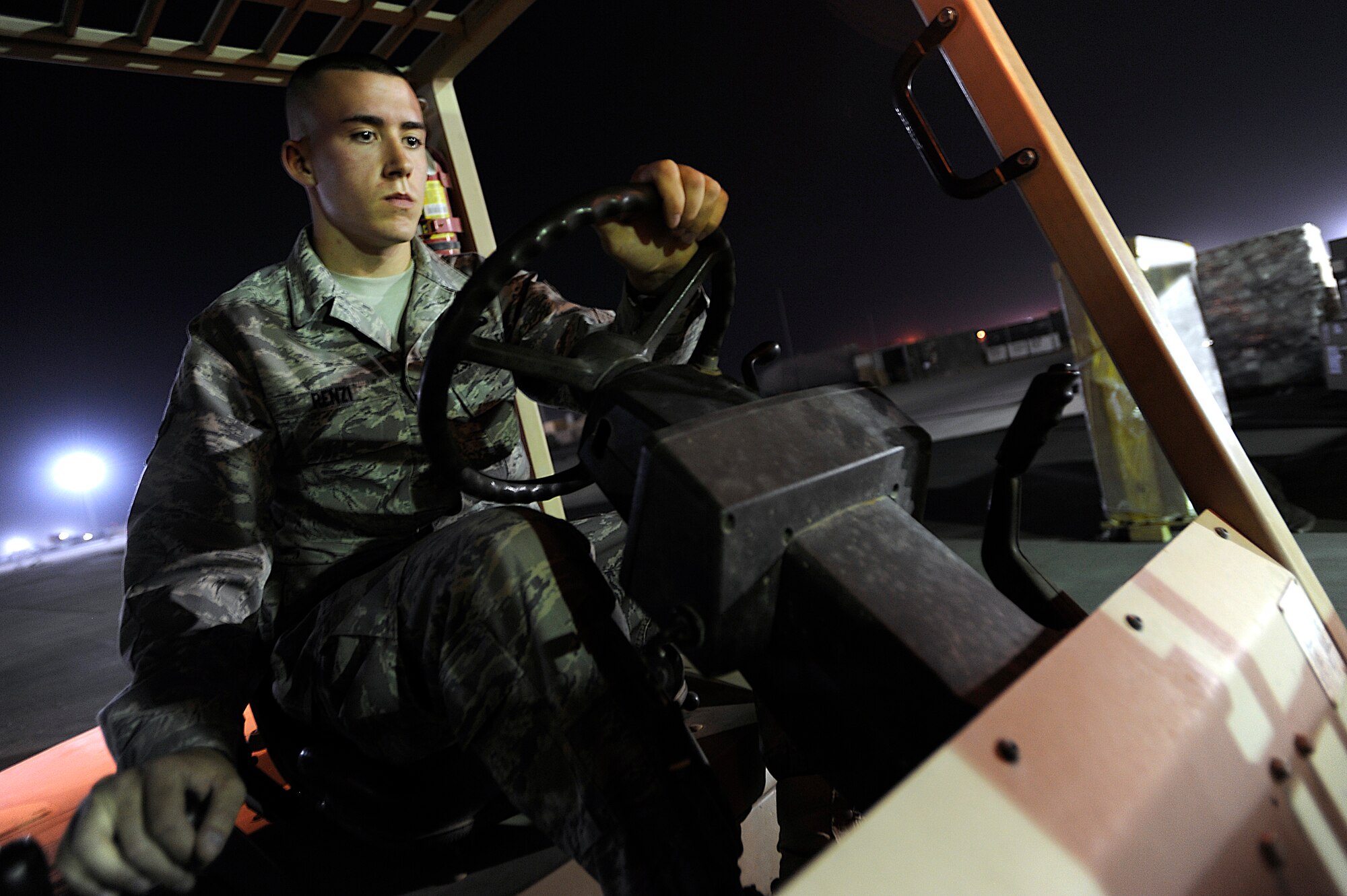 Airman 1st Class Martin Renzi operates a forklift Oct. 10 at Joint Base Balad, Iraq. He recently helped put out a fire in the Aircraft Supply Store here, saving millions of dollars in Air Force assets. Renzi, a supply technician assigned to the 332nd Expeditionary Logistics Readiness Squadron, is deployed from McGuire Air Force Base, N.J., and his hometown is Springfield, Mass. (U.S. Air Force photo/Airman 1st Class Jason Epley)