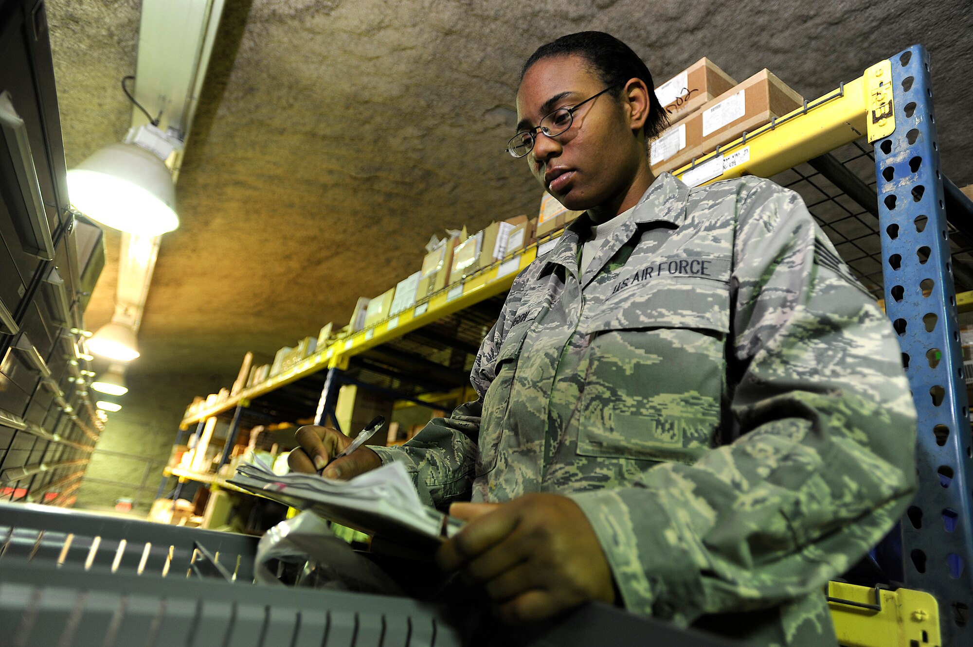 Staff Sgt. Akeilee Murchison performs a warehouse validation Oct. 10 at Joint Base Balad, Iraq. She recently helped put out a fire in the Aircraft Supply Store here, saving millions of dollars in Air Force assets. Murchison, a supply technician assigned to the 332nd Expeditionary Logistics Readiness Squadron, is deployed from Westover Air Reserve Base, Mass., and her hometown is Springfield, Mass. (U.S. Air Force photo/Airman 1st Class Jason Epley)
