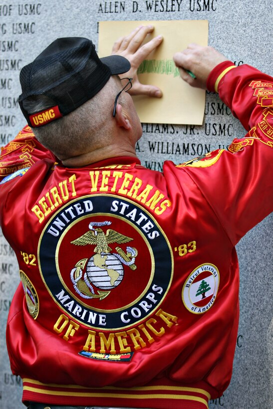 A Beirut veteran takes a relief of his fallen brother on 'The Other Wall' after the 25th Beirut Bombing Observance Ceremony at the Camp Lejeune Memorial Gardens aboard Marine Corps Base Camp Lejeune, N.C., Oct. 23. There are 273 names etched in stone to honor the names of the Marines,::r::::n::sailors and soldiers who gave their lives on the peace keeping mission that began the Global War on Terrorism.