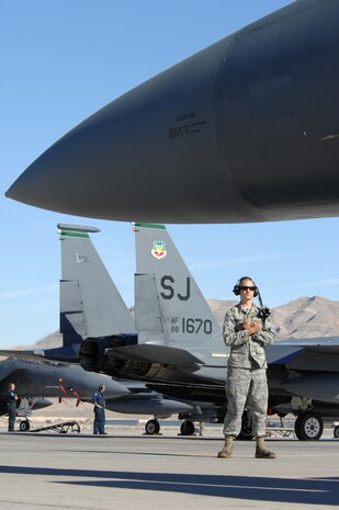 Senior Airman Johnathan DeWerdt, an F-15E crew chief assigned to the 4th Aircraft Maintenance Squadron, Seymour Johnson Air Force Base, N.C., prepares to taxi his aircraft for a training mission during Red Flag 09-1 at Nellis AFB, Nev., Oct. 22, 2008. Red Flag is a multi-national exercise providing a realistic environment to practice combat scenarios. The experience gained during the exercise is vital to the survival of pilots in combat.
(U.S. Air Force Photo/Senior Airman Larry E. Reid Jr.)