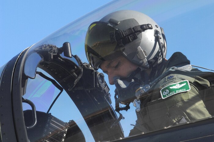 Lt. Col. Lance Bunch, an F-15E pilot and 335th Fighter Squadron Commander, Seymour Johnson Air Force Base, N.C., performs pre-flight checks for a training mission during Red Flag 09-1 at Nellis AFB, Nev., Oct. 22, 2008. Red Flag is a multi-national exercise providing a realistic environment to practice combat scenarios. The experience gained during the exercise is vital to the survival of pilots in combat.
(U.S. Air Force Photo/Senior Airman Larry E. Reid Jr.)