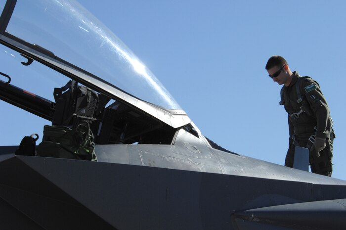 Capt. John Cox, an F-15E pilot assigned to the 335th Fighter Squadron, Seymour Johnson Air Force Base, N.C., inspects his aircraft in preparation for a training mission during Red Flag 09-1 at Nellis AFB, Nev., Oct. 22, 2008. Red Flag is a multi-national exercise providing a realistic environment to practice combat scenarios. The experience gained during the exercise is vital to the survival of pilots in combat.
(U.S. Air Force Photo/Senior Airman Larry E. Reid Jr.)