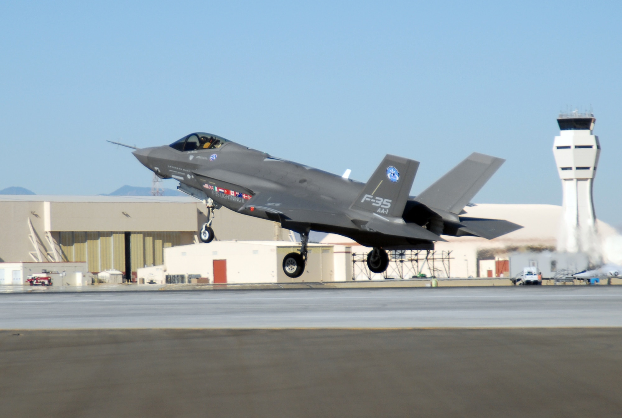 An F-35 Joint Strike Fighter, marked AA-1, lands at an Edwards runway Oct. 23. The F-35 Joint Strike Fighter Integrated Test Force concluded an air start testing here. (Air Force photo by Senior Airman Julius Delos Reyes)