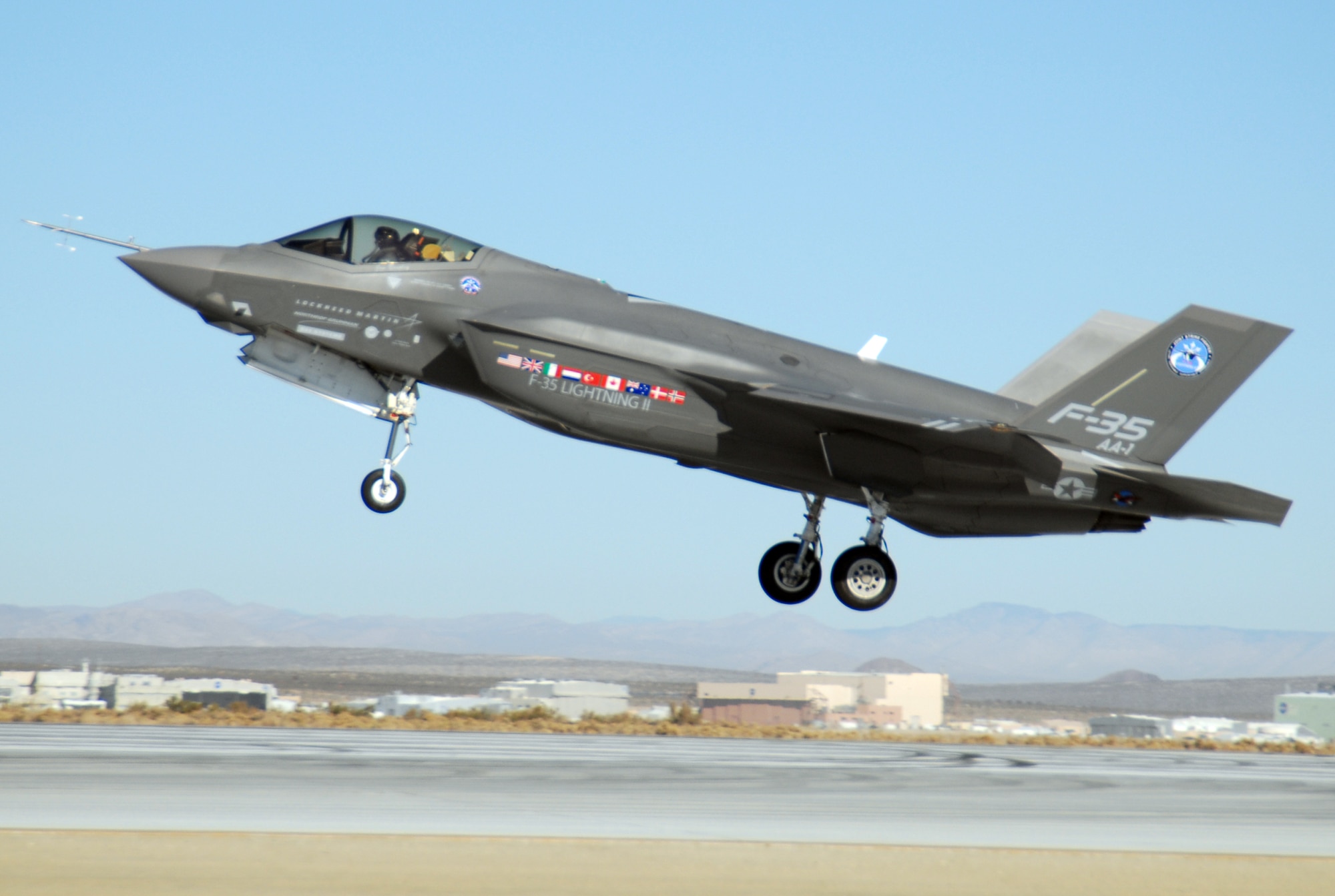 An F-35 Joint Strike Fighter, marked AA-1, lands at an Edwards runway Oct. 23. The aircraft arrived here Oct. 1 from a Lockheed Martin plant at Fort Worth, Texas. (Air Force photo by Senior Airman Julius Delos Reyes)