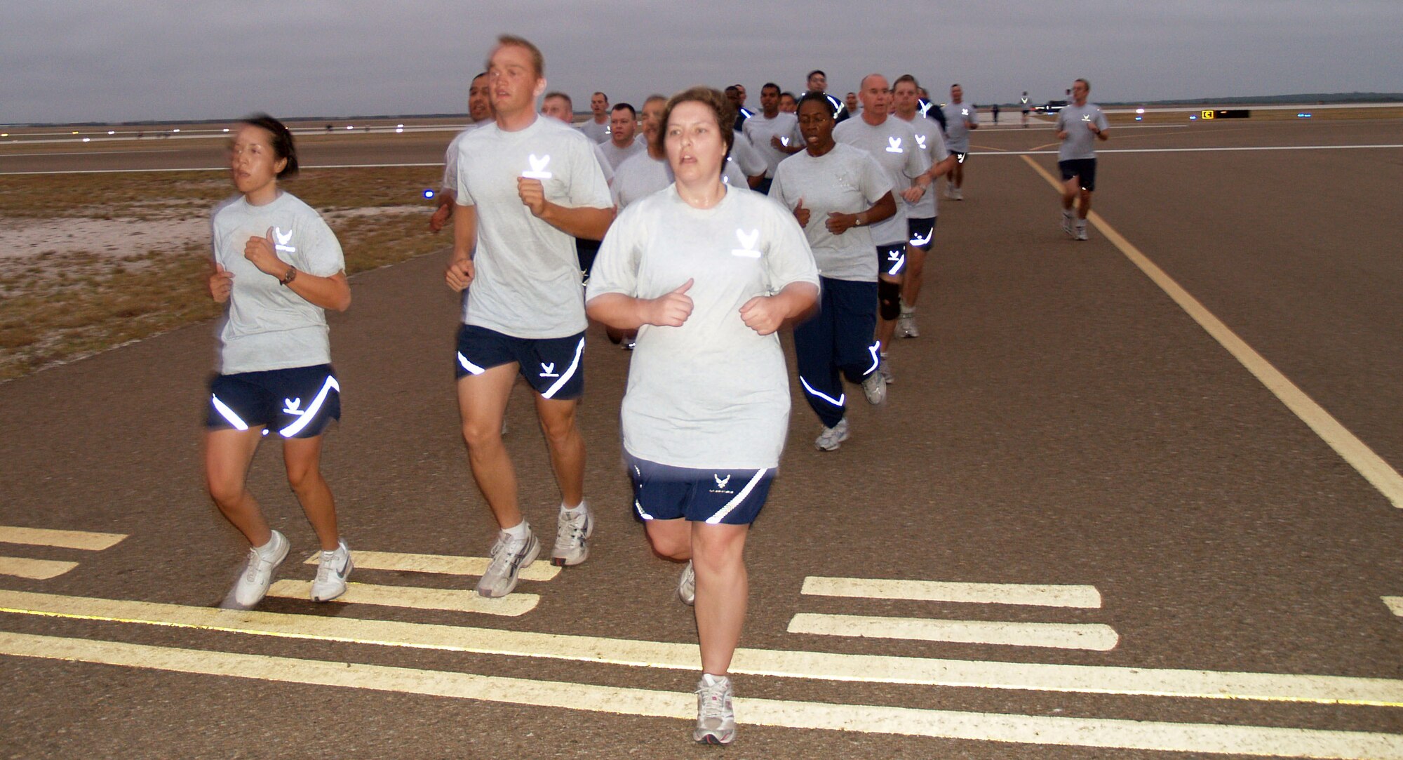 LAUGHLIN AIR FORCE BASE, Texas -- Runners cross the finish line at the completion of the 1.5 mile run around the flight line during Fitness Esprit de Corps Oct. 22. Fitness Esprit de Corps was the being of activities for Wingman Day this year. (U.S. Air Force photo by Ron Scharven)