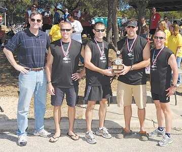 From left to right: Gen. Stephen Lorenz, Air Education and Training Command commander, awarded the top trophy to the Air Force Personnel Center?s ?Flesh Peddlers:? Steve Frank, Drew Martin, Tim Moser and Bill Relyea. Flesh Peddlers finished the competition with the fastest overall time of 2:19:47. Participants from four U.S. Air Force Bases competed in the triathlon held each year at Canyon Lake. (U.S. Air Force photo by Steve White)