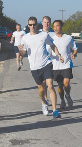 Lance Campbell, Steven Anderson, Jeff Anderson and Zak Zimmerman, from ?Team SOALA,? an Xtreme team, approach a checkpoint during the six-mile run of the Rambler 120 Team Challenge. Team Support Officers Acting Like Athletes earned the bronze in the All-male Xtreme division. Participants from four U.S. Air Force Bases competed in the triathlon held each year at Canyon Lake. (U.S. Air Force photo by Steve White)
