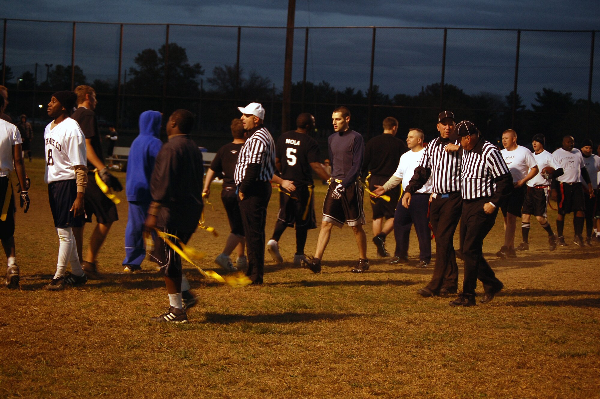 Team members from the U.S. Air Force Expeditionary Center's "Screaming Eagles" intramural flag football team exchange handshakes with team members from the 305th Services Squadron Oct. 22, 2008, on McGuire Air Force Base, N.J.  The USAF EC defeated McGuire Services 12-6 to improve to 9-3 on the season.  (U.S. Air Force Photo/Tech. Sgt. Scott T. Sturkol)