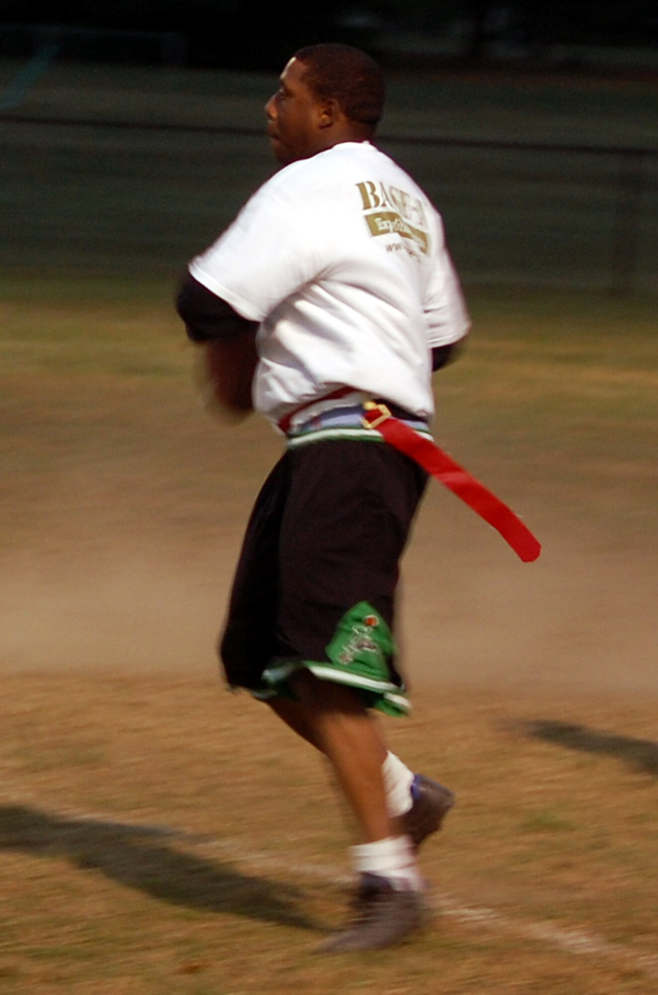 Quarterback Cecil Evans from the U.S. Air Force Expeditionary Center's "Screaming Eagles" intramural flag football team prepares to throw during football action Oct. 22, 2008, against the 305th Services Squadron on McGuire Air Force Base, N.J.  The USAF EC defeated McGuire Services 12-6 to improve to 9-3 on the season.  (U.S. Air Force Photo/Tech. Sgt. Scott T. Sturkol)