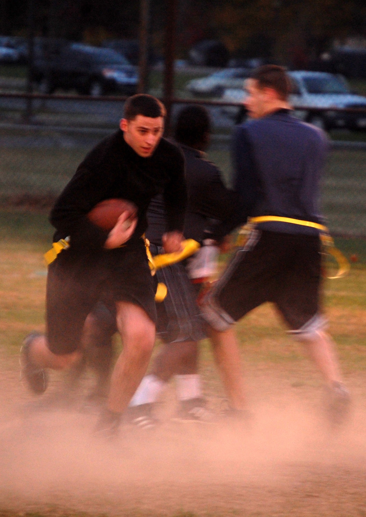 The quarterback for the 305th Services Squadron intramural flag football team scrambles for some yardage during football action Oct. 22, 2008, on McGuire Air Force Base, N.J., against the U.S. Air Force Expeditionary Center's "Screaming Eagles." McGuire Services lost the game 12-6 to the USAF EC who improved to 9-3 on the season.  (U.S. Air Force Photo/Tech. Sgt. Scott T. Sturkol)