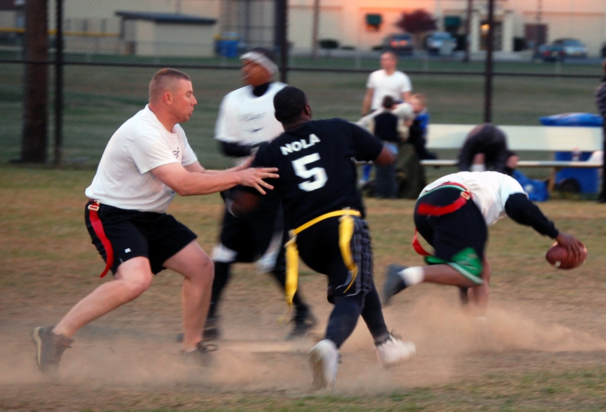 Jason Marsh of the U.S. Air Force Expeditionary Center's "Screaming Eagles" flag football team makes a block during football action Oct. 22, 2008, on McGuire Air Force Base, N.J., against the 305th Services Squadron.  The USAF EC defeated McGuire Services 12-6 to improve to 9-3 on the season.  (U.S. Air Force Photo/Tech. Sgt. Scott T. Sturkol)