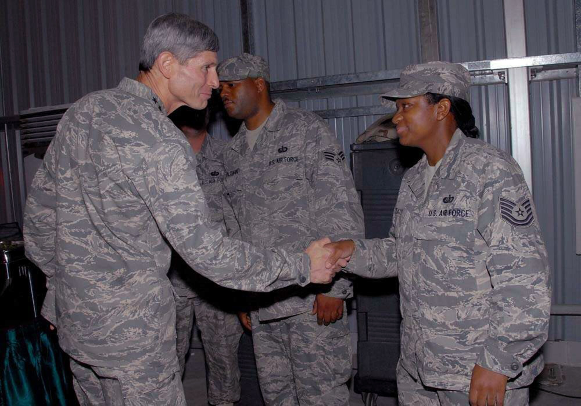 Gen. Norton A. Schwartz thanks Tech. Sgt. Toni Beaty after a senior leader dinner Oct. 22 at an air base in Southwest Asia. General Schwartz is the chief of staff of the Air Force, and Sergeant Beaty is a dining facility manager for the 380th Expeditionary Services Squadron. (U.S. Air Force photo/Tech. Sgt. Denise Johnson) 
