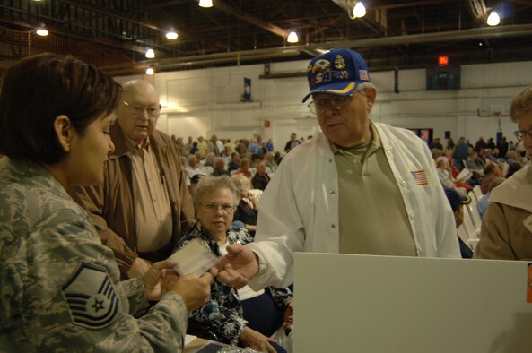 Master Sgt. Anna Chapa, 55th Dental Squadron, discusses retiree dental options with retired Tech. Sgt. John Barrett at the annual Retiree Appreciation Day Oct. 19. Services offered at this annual event include briefings and booths from the retiree affairs office, the airman and family readiness center, various veterans’ affairs offices and TRICARE among others as well as base tours and flu shots from the 55th Medical Group. (U.S. Air Force Photo By Tech. Sgt. Rhonda Moraski)