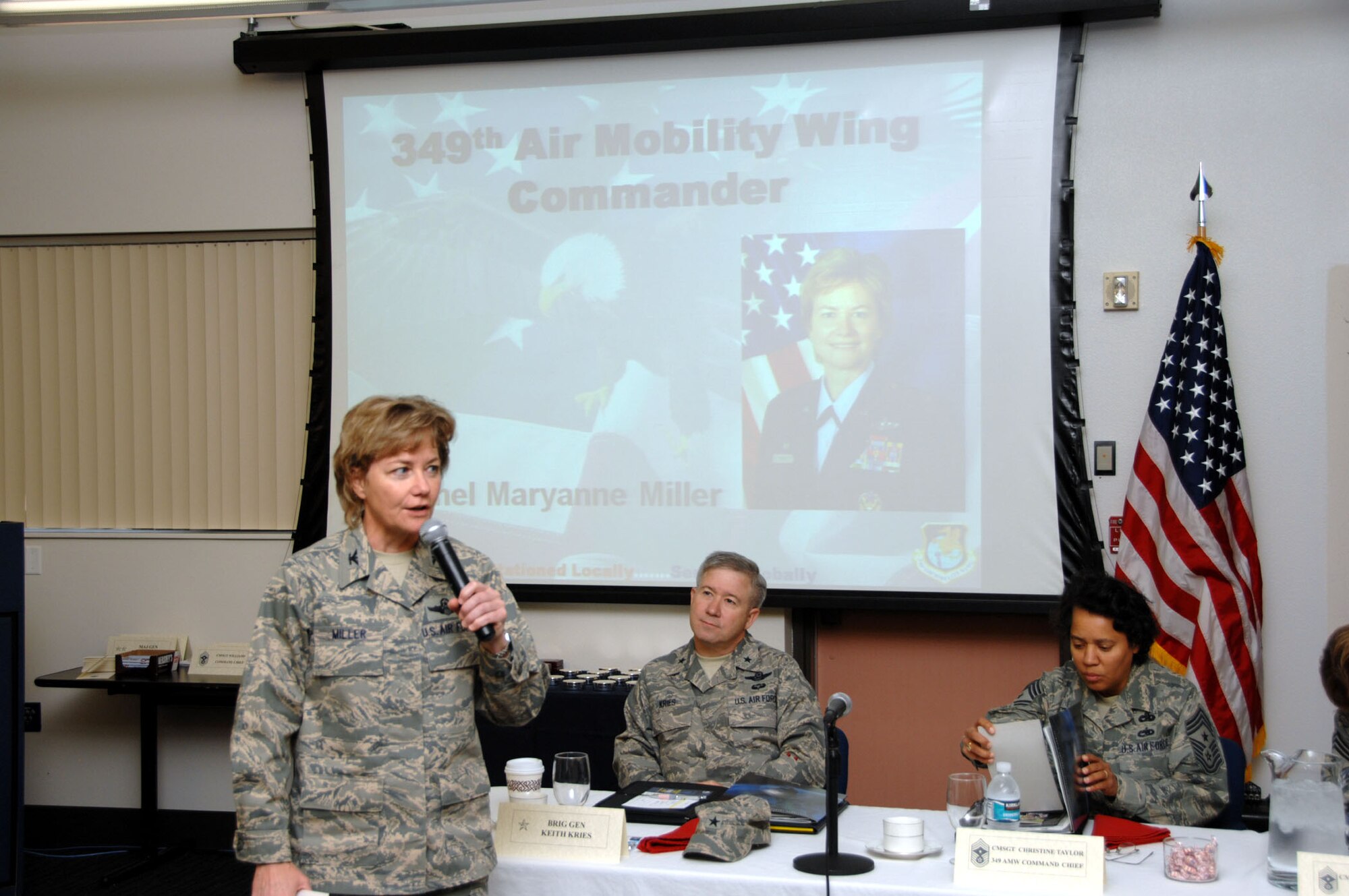 TRAVIS AIR FORCE BASE, Calif. -- Col. Maryanne Miller, Commander 349th Air Mobility Wing welcomes over 130 attendees to the 8th Annual Travis Air Force Base Wing Enlisted Workshop.  Also pictured left to right are Brigadier General Keith D. Kries, Deputy Assistant Chief of Staff for Operations (J3), U.S. Forces Korea and United Nations Command and Chief Master Sgt. Christine A. Taylor, Command Chief 349 AMW.