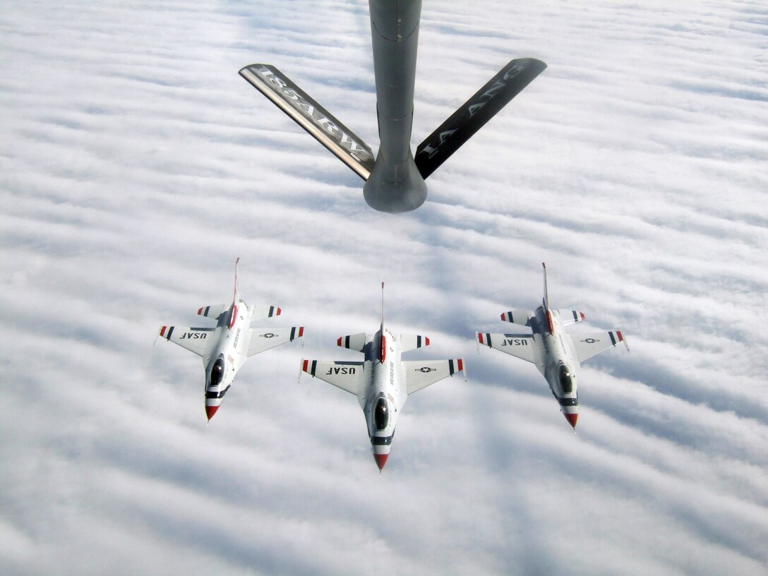 Three Thunderbirds returning to Nellis from an air show at Dobbins Air Force Base pause for a photo op while being refueled by An Iowa Air National Guard KC-135 from Sioux City. 