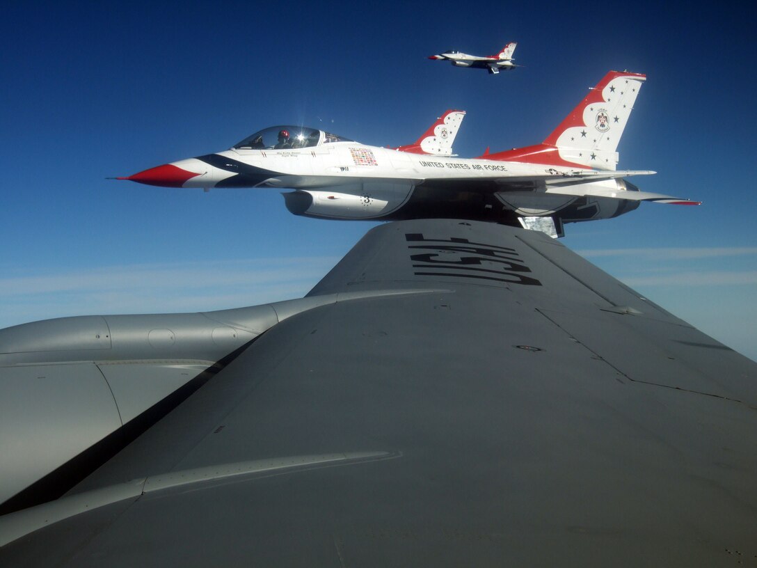 Three Thunderbirds returning to Nellis from an air show at Dobbins Air Force Base pause for a photo op while being refueled by An Iowa Air National Guard KC-135 from Sioux City. 