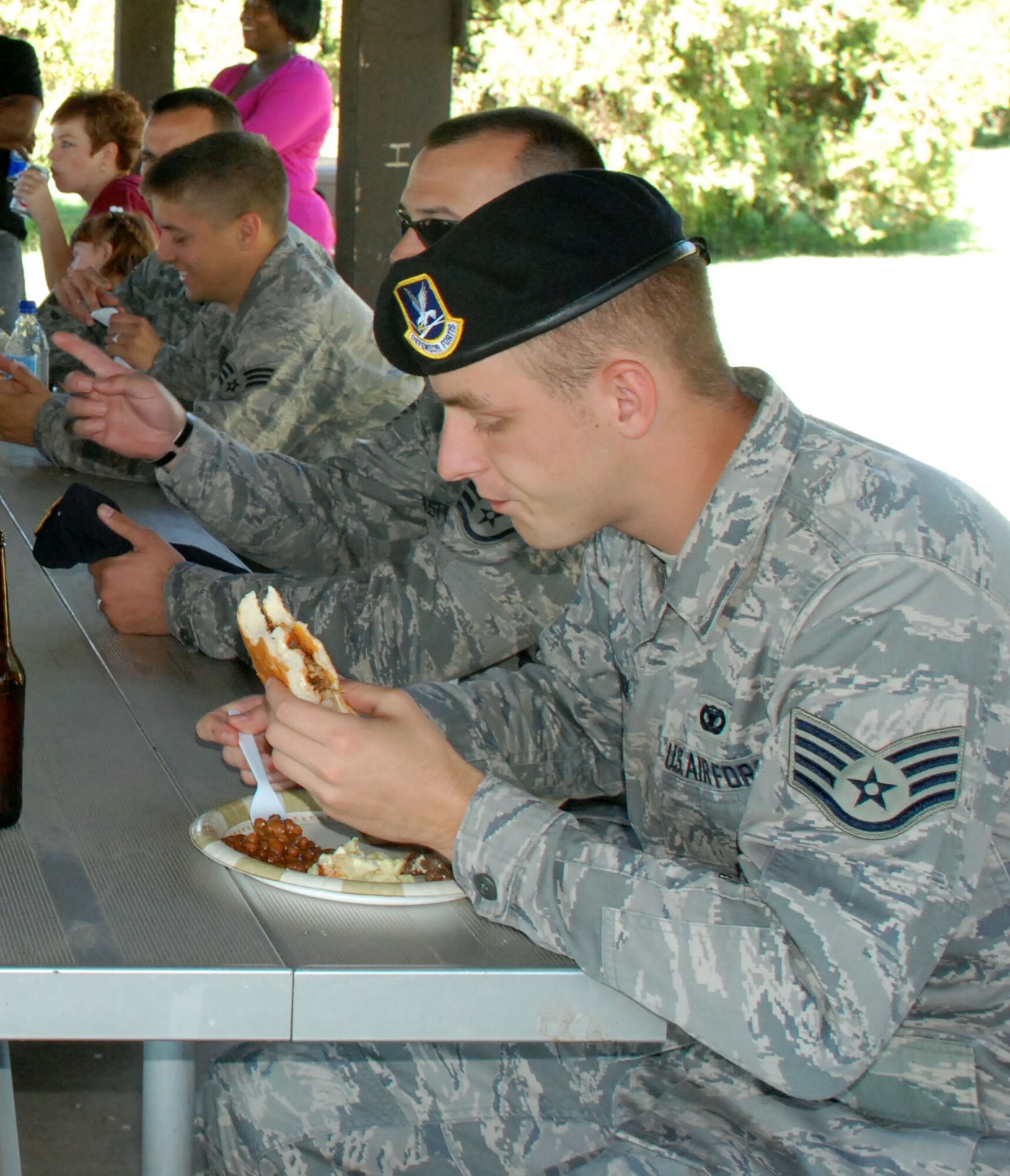 Members of the 82nd Security Forces Squadron feast on barbecue at a picnic Oct. 20. Sheppard held the picnic to welcome back 17 members of the 82nd SFS from a six month deployment to Iraq. (U.S. Air Force photo/Airman 1st Class Candy Miller)