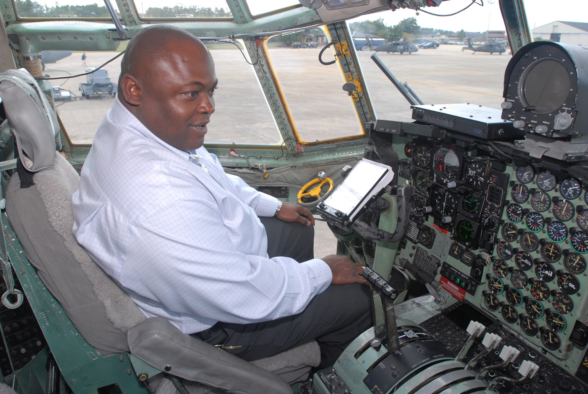 Vincent Horton, a Hobbs, N.M., civic leader, checks out the cockpit Oct. 23 of an Arkansas Air National Guard C-130E cargo aircraft.