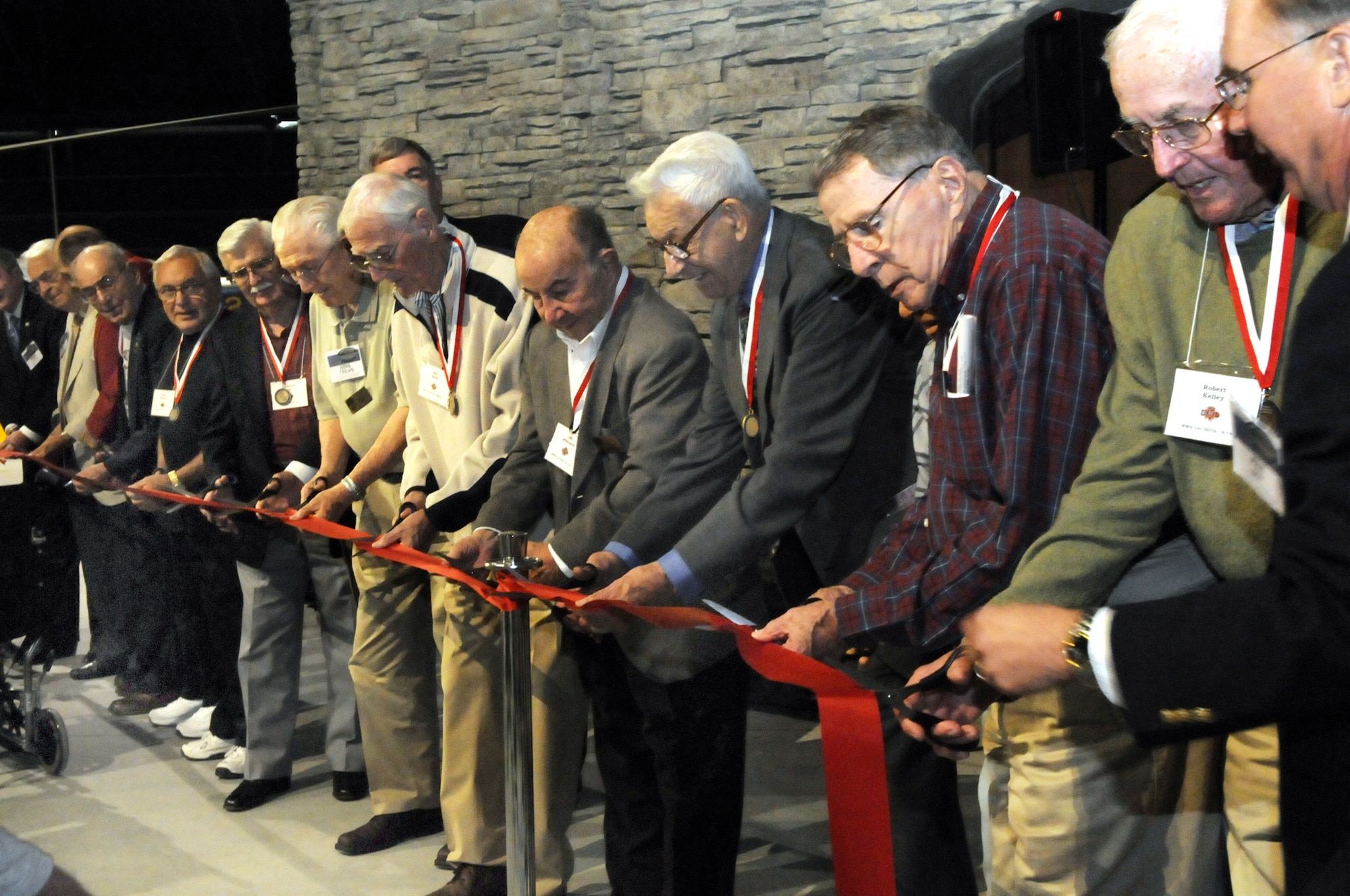 WWII veterans were invited to cut the ribbon to open the new exhibit. U. S. Air Force photo by Sue Sapp