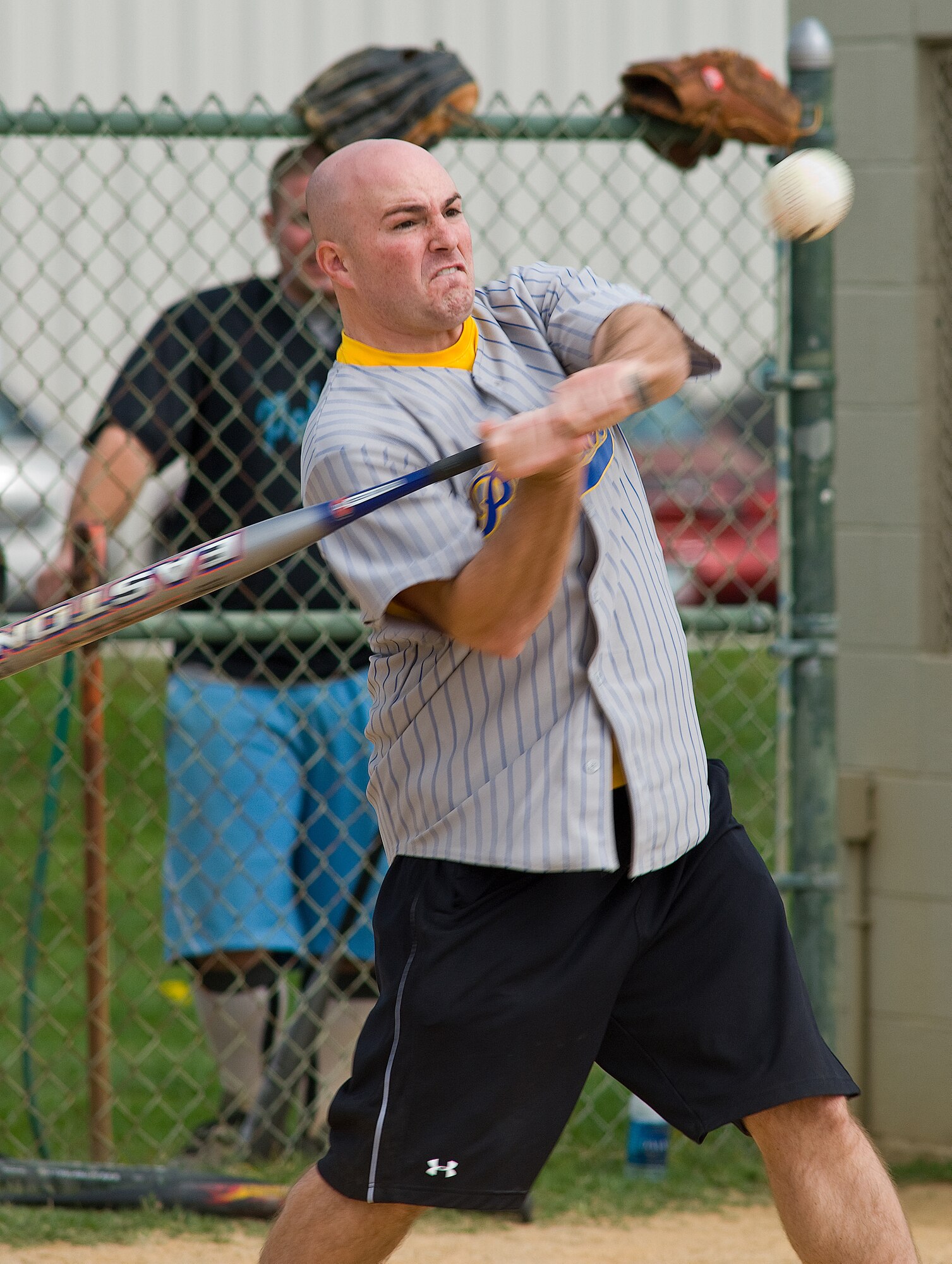 1st Lt. Bryce Benson, 9th Airlift Squadron, takes a big swing during the 3-2 Pitch Softball Tournament at Wing Sports Day Oct. 15.  (U.S. Air Force photo/Roland Balik)