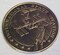 This gold commemorative coin shows the International Space Station and space shuttle. It contains metal from the unity node flown on Mission STS-88. (U.S. Air Force photo)
