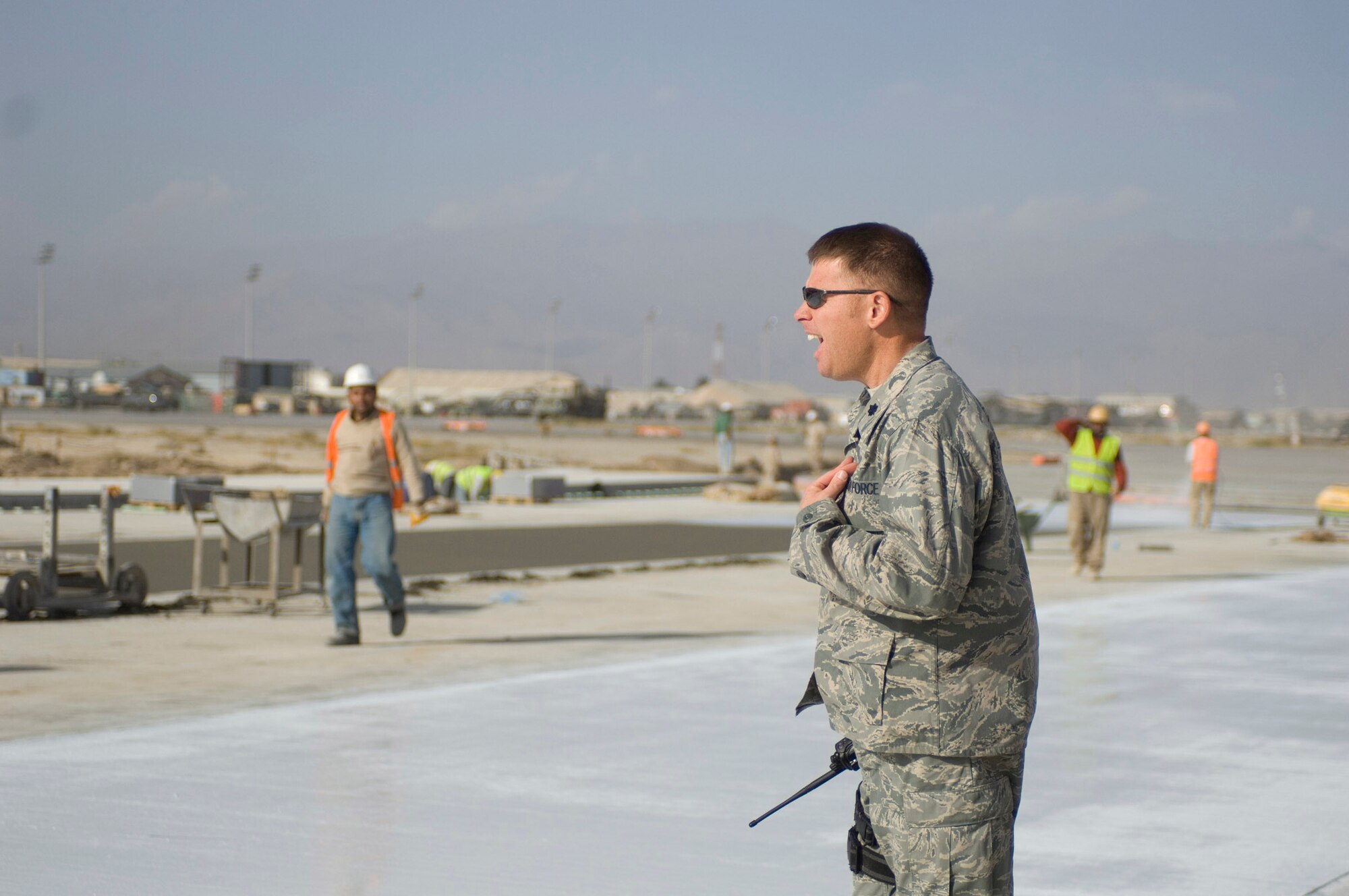 Lt. Col. Kevin Virts, 455th Expeditionary Operations Support Squadron Airfield Operations Flight liaison, visits a construction sight on the flightline at Bagram Air Field, Afghanistan, Oct. 22. As the liaison between the military and the numerous contractors involved with airfield management, Colonel Virts is responsible for monitoring the progress of multiple construction projects. (U.S. Air Force photo by Staff Sgt. Rachel Martinez/released)