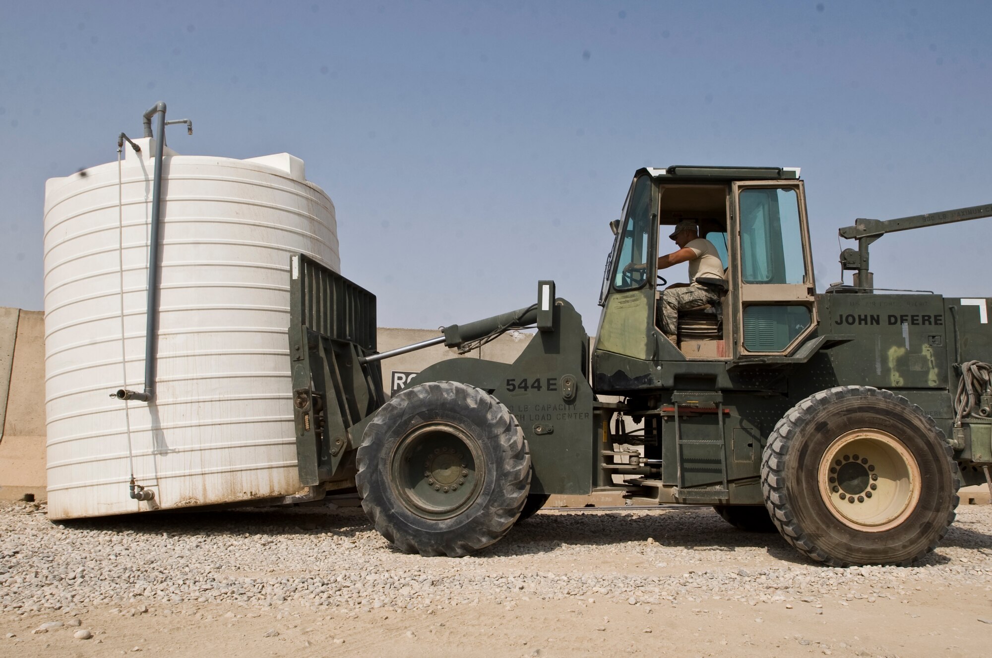 ALI BASE, Iraq -- Staff Sgt. Steven Javinar, 407th Expeditionary Civil Engineer Squadron, mounts a water tank at the location of the new Shoppette Oct. 22, 2008. The water tank will provide running water for a snack bar. People stationed here now have another Army and Air Force Exchange Service store to purchase necessities. Javinar is deployed from F.E. Warren Air Force Base, Wyo. (U.S. Air Force photo/Senior Airman Christopher Griffin) 