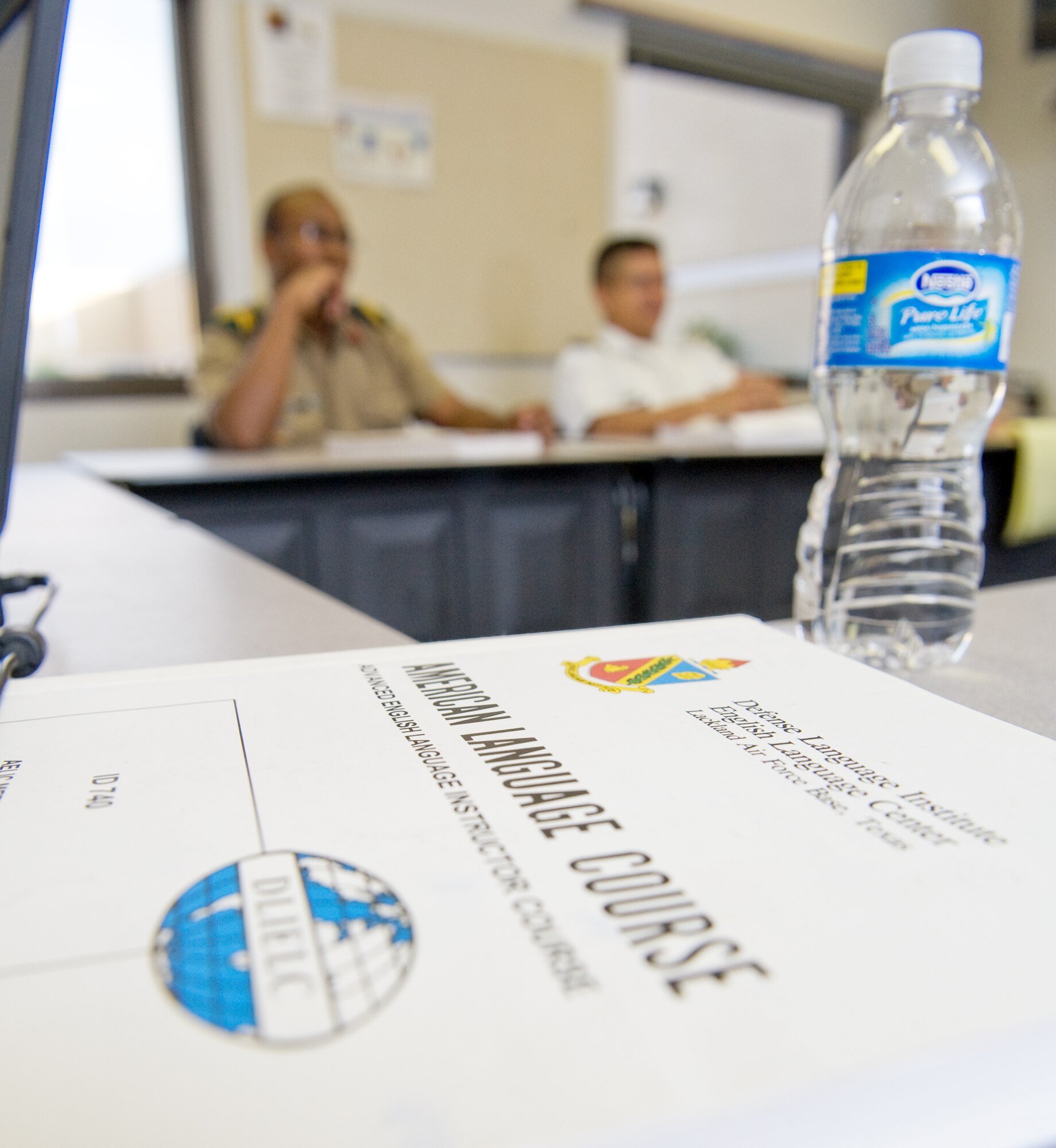 Course textbooks and water are necessary items in the American English Language Instructor Course Oct. 22at the Defense Language Institute, Lackland Air Force Base, Texas.  Each day, the future English instructors carry on long discussions after evenings of study work. (U.S. Air Force photo/Lance Cheung)