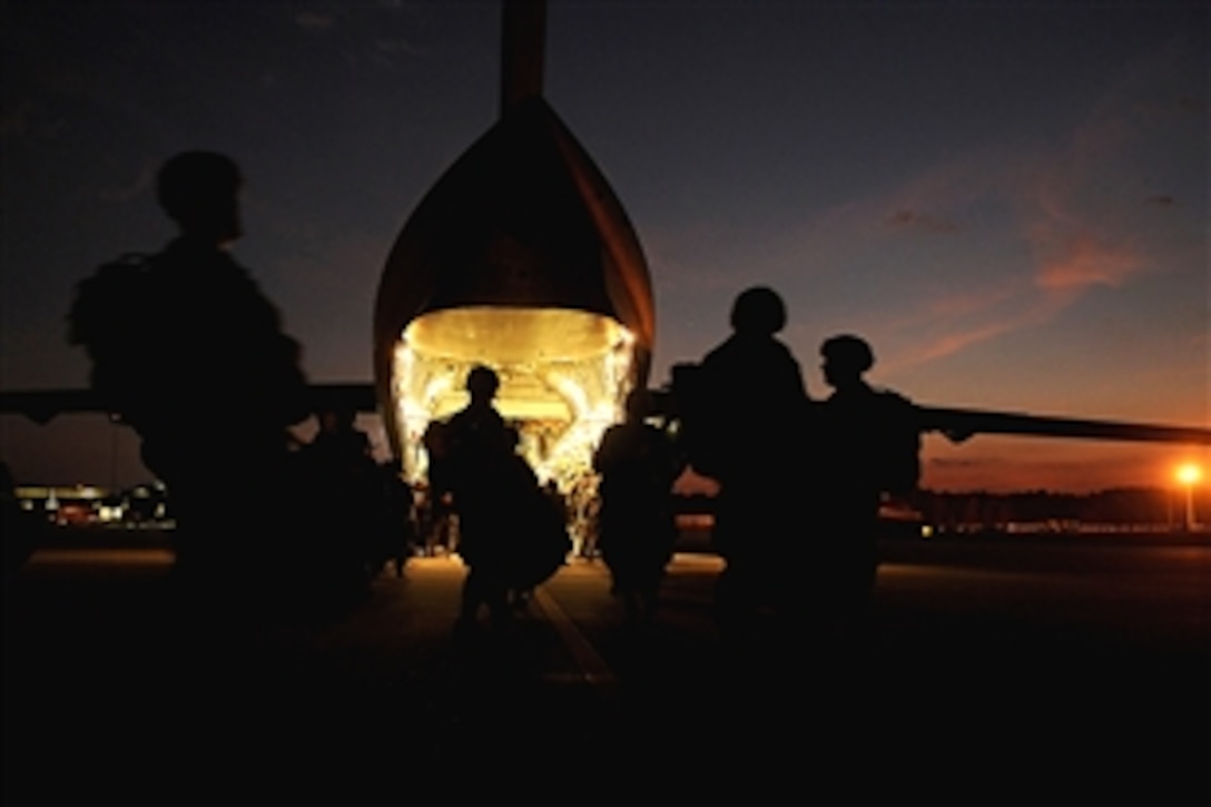 U.S. Army soldiers get ready to board an aircraft during a joint forcible entry exercise on Pope Air Force Base, N.C., Oct. 21, 2008. The soldiers are assigned to the 82nd Airborne Division. The exercise provides U.S. soldiers assigned to the 82nd Airborne Division with training on real-world contingency operations.