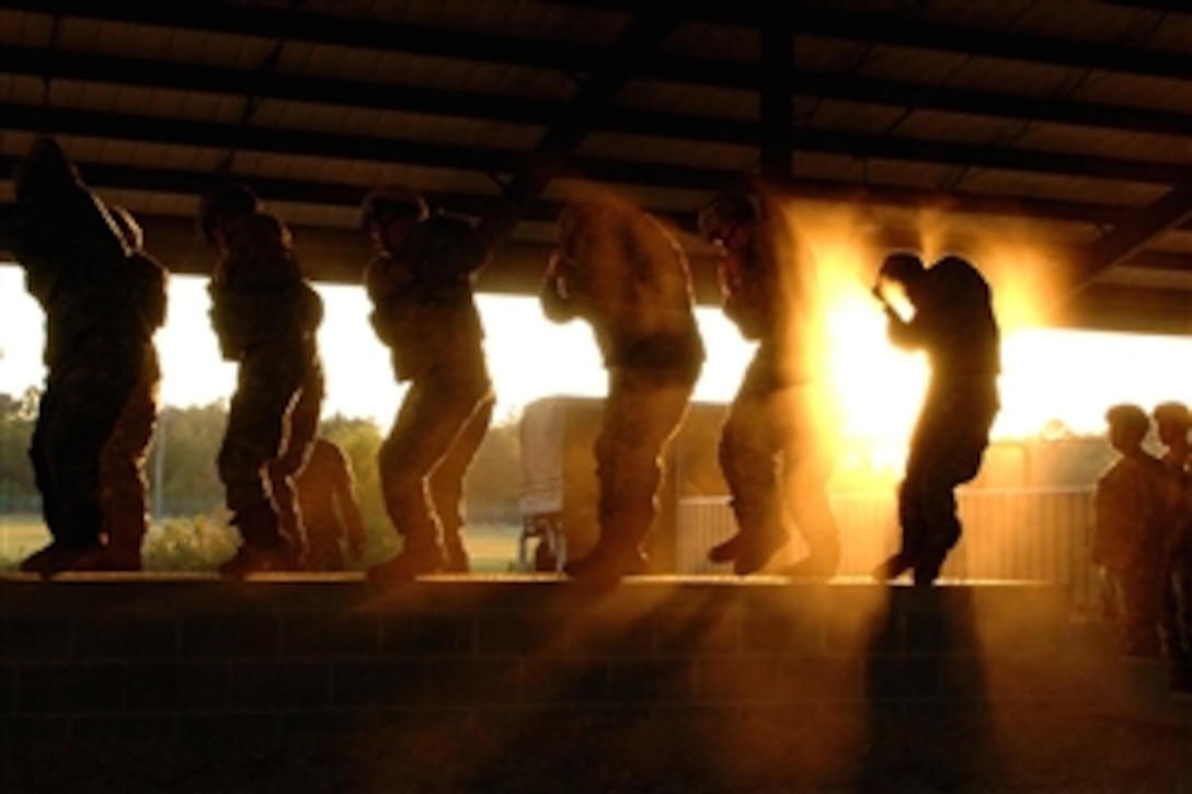 U.S. Army paratroopers of the 82nd Airborne Division conduct pre-jump parachute landing fall training during a joint forcible entry exercise on Pope Air Force Base, N.C., Oct. 21, 2008. The exercise provides soldiers with training for contingency operations.