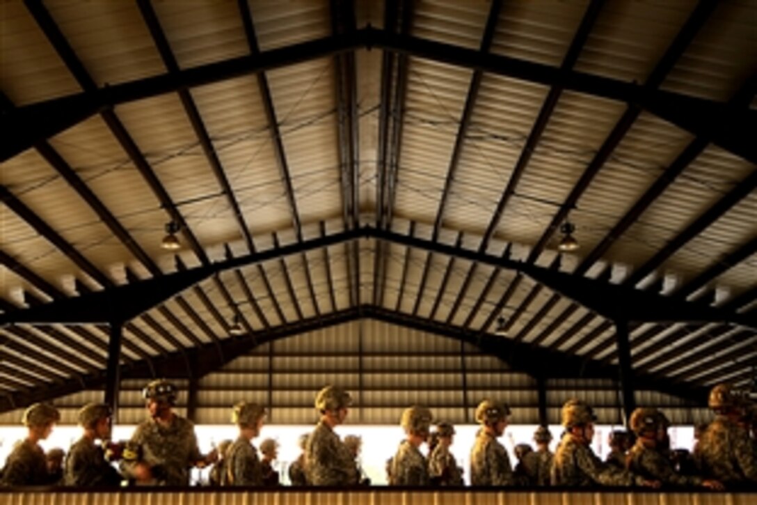 U.S. Army paratroopers assigned to the 82nd Airborne Division run through pre-jump mock door training and landings before boarding C-17 Globemaster III's and C-130 Hercules in preparation for or a night airdrop on a Fort Bragg, N.C., drop zone, Oct. 21, 2008. The airdrop is part of an integrated joint Army and Air Force training operation known as Joint Forcible Entry Exercise at Fort Bragg, N.C., Oct. 21, 2008. 