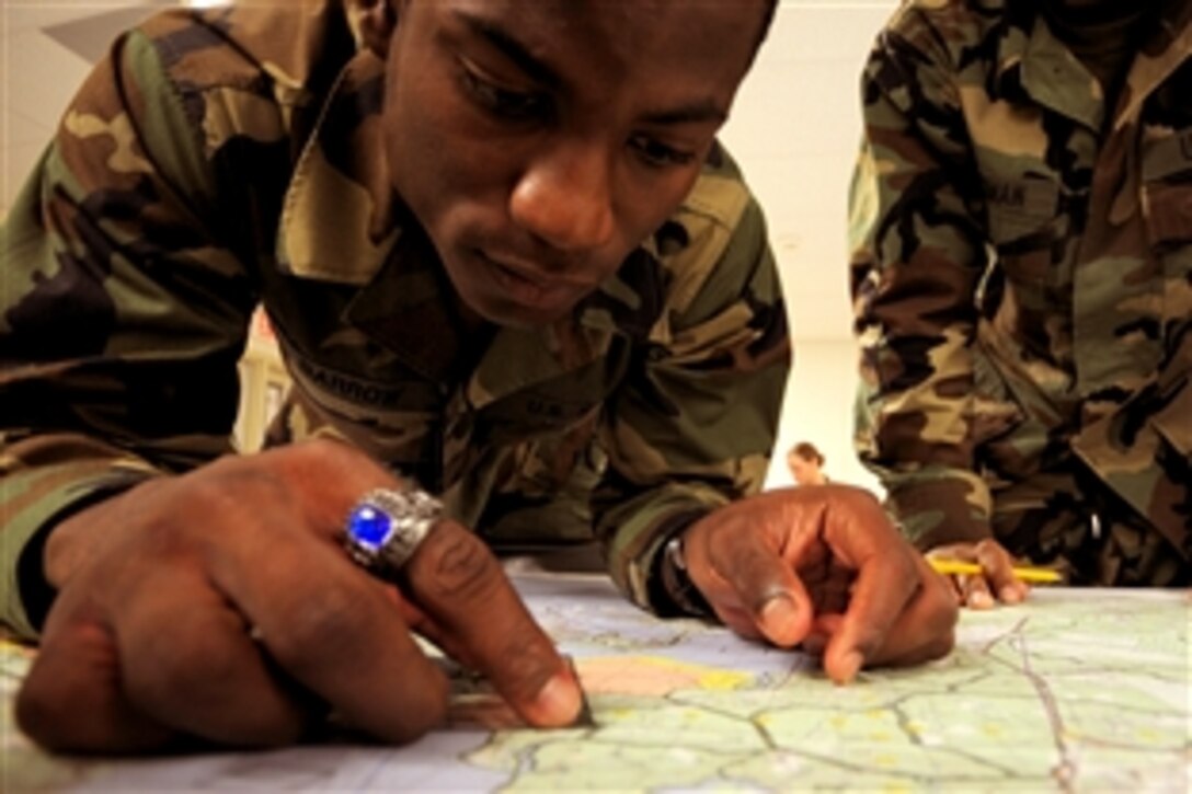 Navy Seaman Ricardo Barrow practices his land navigation skills during a Navy Expeditionary Combat Skills School training exercise, Gulfport, Miss., Oct. 9, 2008. The school is designed to build basic-level battlefield competence for sailors from the newly formed Navy Expeditionary Combat Command.