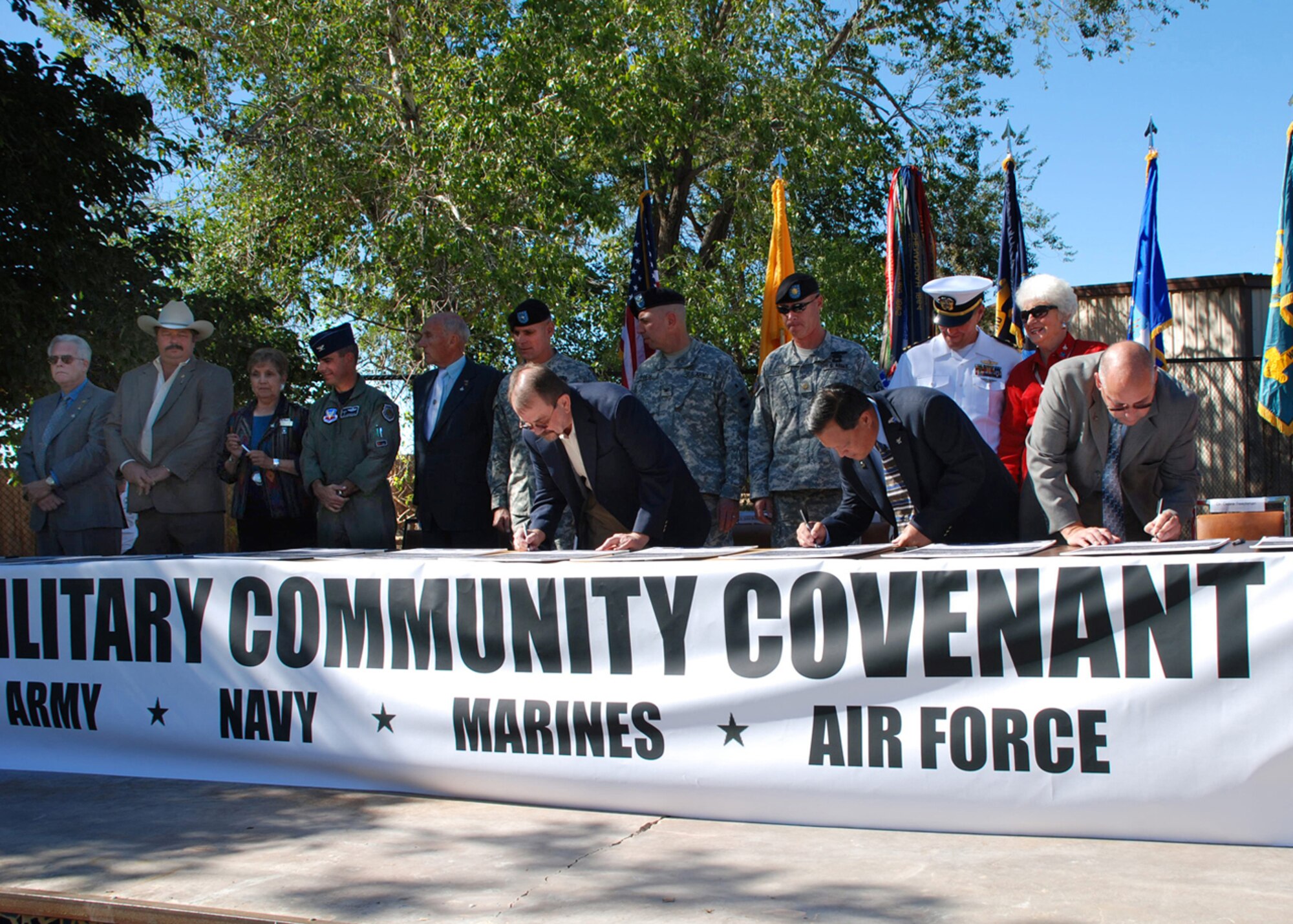 Representatives of Alamogordo, Las Cruces, Holloman Air Force Base, White Sands Missile Range, Ft. Bliss and the New Mexico National Guard sign several copies of the Army Community Covenant at the Alameda Zoo in Alamogordo, N.M. The ceremonial signing was a commitment to work together in support of military members and their families (White Sands Missile Range photo by Tom Fuller)
