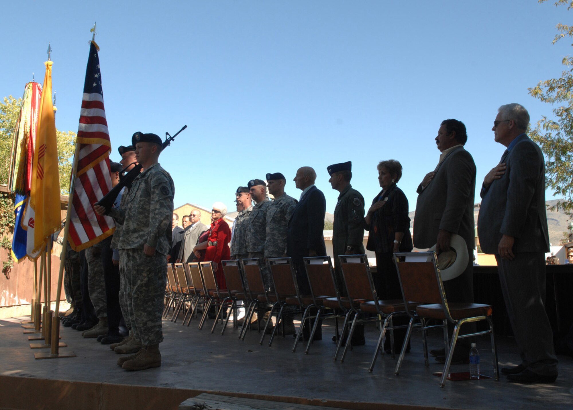 Representatives of Alamogordo, N.M., Las Cruces, N.M., Holloman Air Force Base, White Sands Missile Range, Ft. Bliss and the New Mexico National Guard stand at attention during the presentation of the nation's colors in Alamogordo, October 18. The ceremony was held at the Alameda Zoo after the signing of the Army Community Covenant that supported the Soldiers and their families. (U.S. Air Force photo/Airman 1st. Class Veronica Salgado)