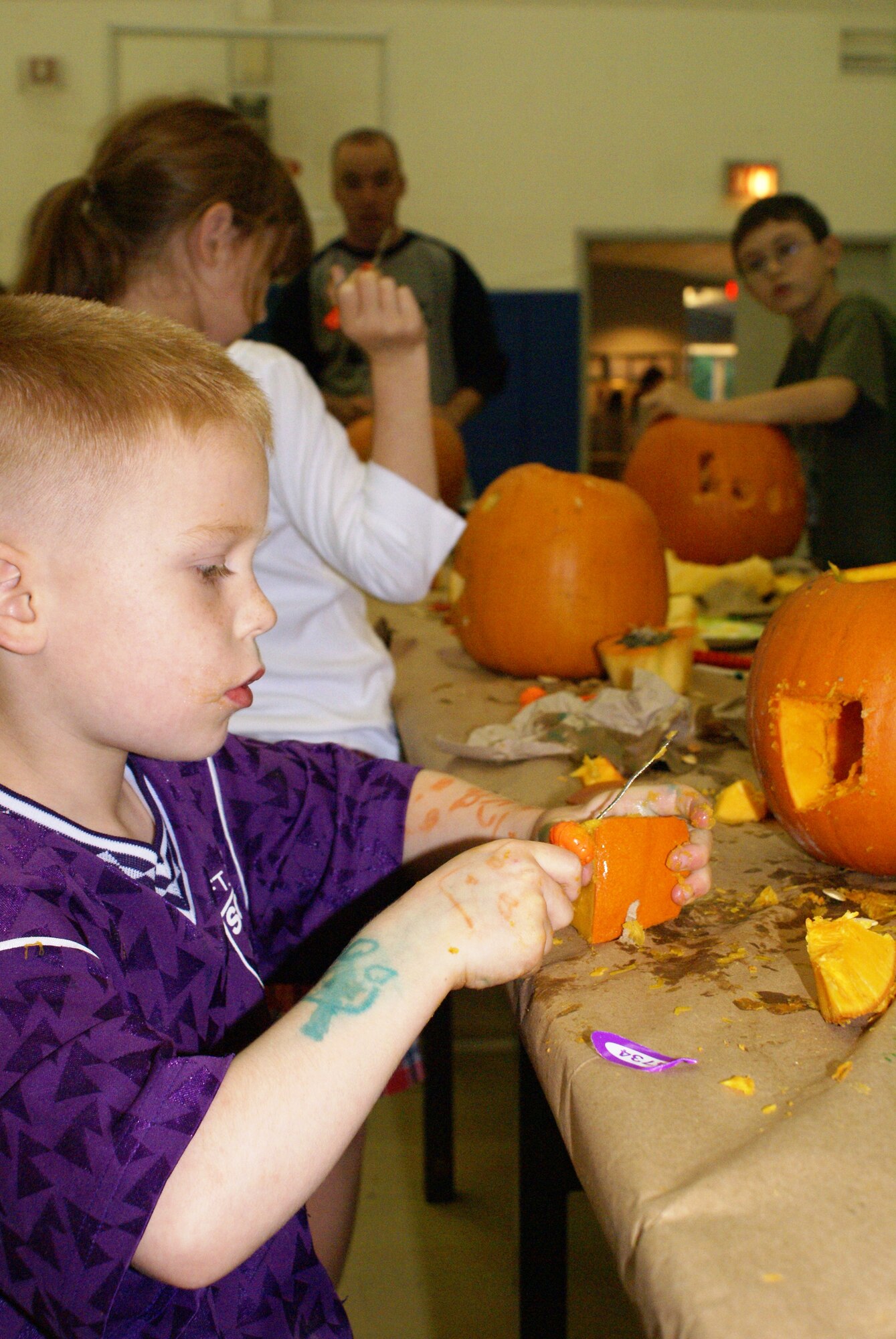 Ben Gardner, a McChord family member, puts the finishing touches on a pumpkin Oct. 17 at the youth center. Tools, treats and cider were available to Team McChord members and their families who came to carve pumpkins. (U.S. Air Force photo/Staff Sgt. Eric Burks)