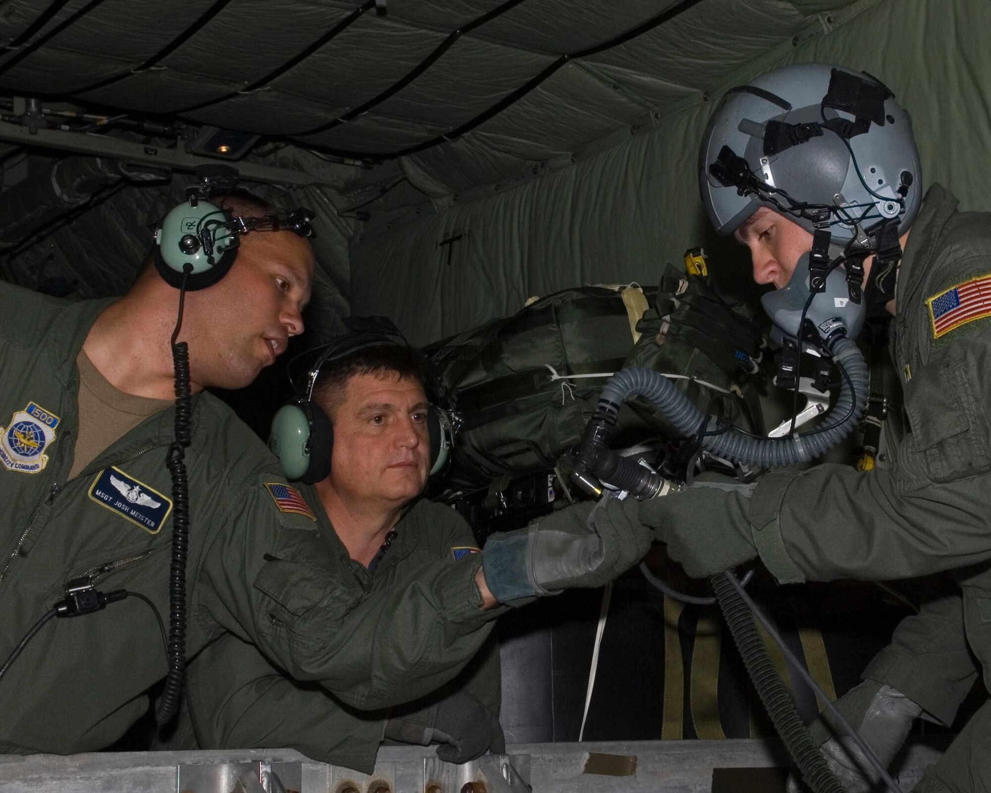 Loadmasters from the 109th Airlift Squadron check the oxygen system during training in a MN Air National Guard C-130H using the Joint Precision Air Drop System, or JPADS, on June 18, 2008.